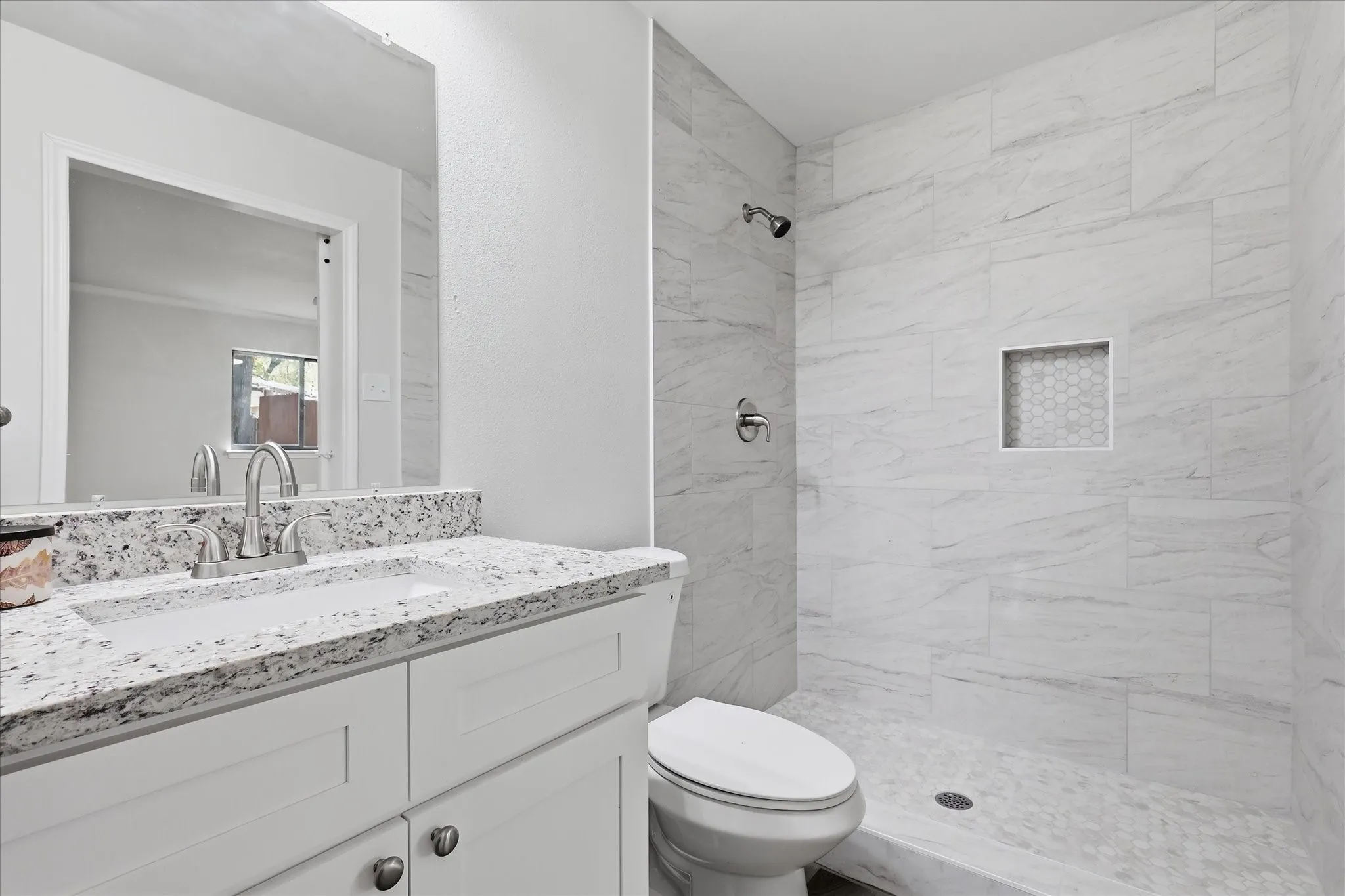 Main bath has granite tops, new cabinets & large walk-in shower.