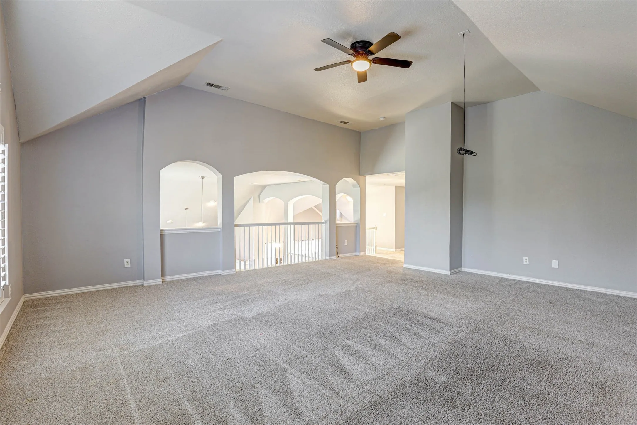 This versatile second-floor space easily adapts to a media room, playroom, or teen retreat.
