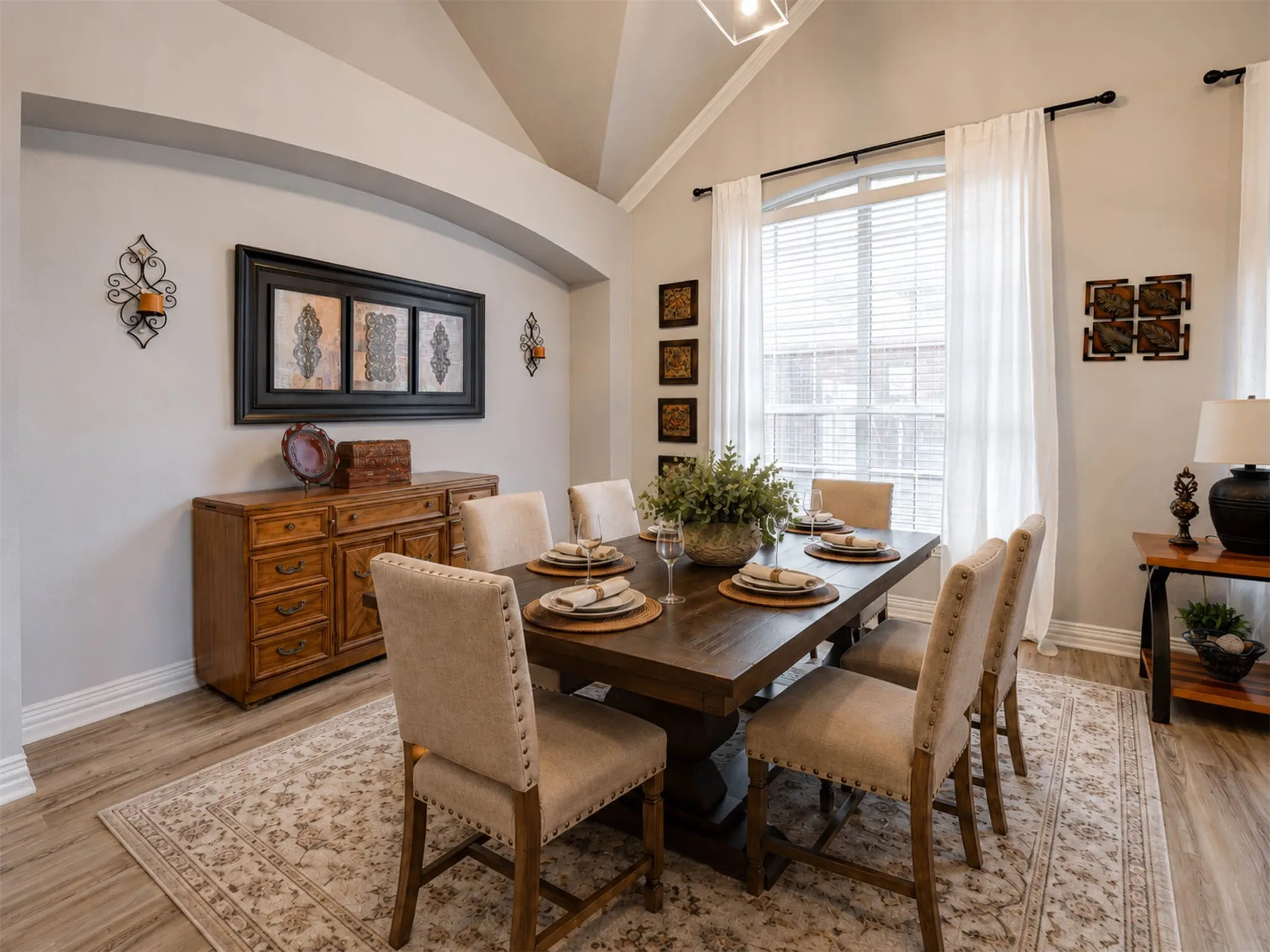 The dining area flows naturally from the living room, offering the perfect space for entertaining and everyday meals. (Staged)
