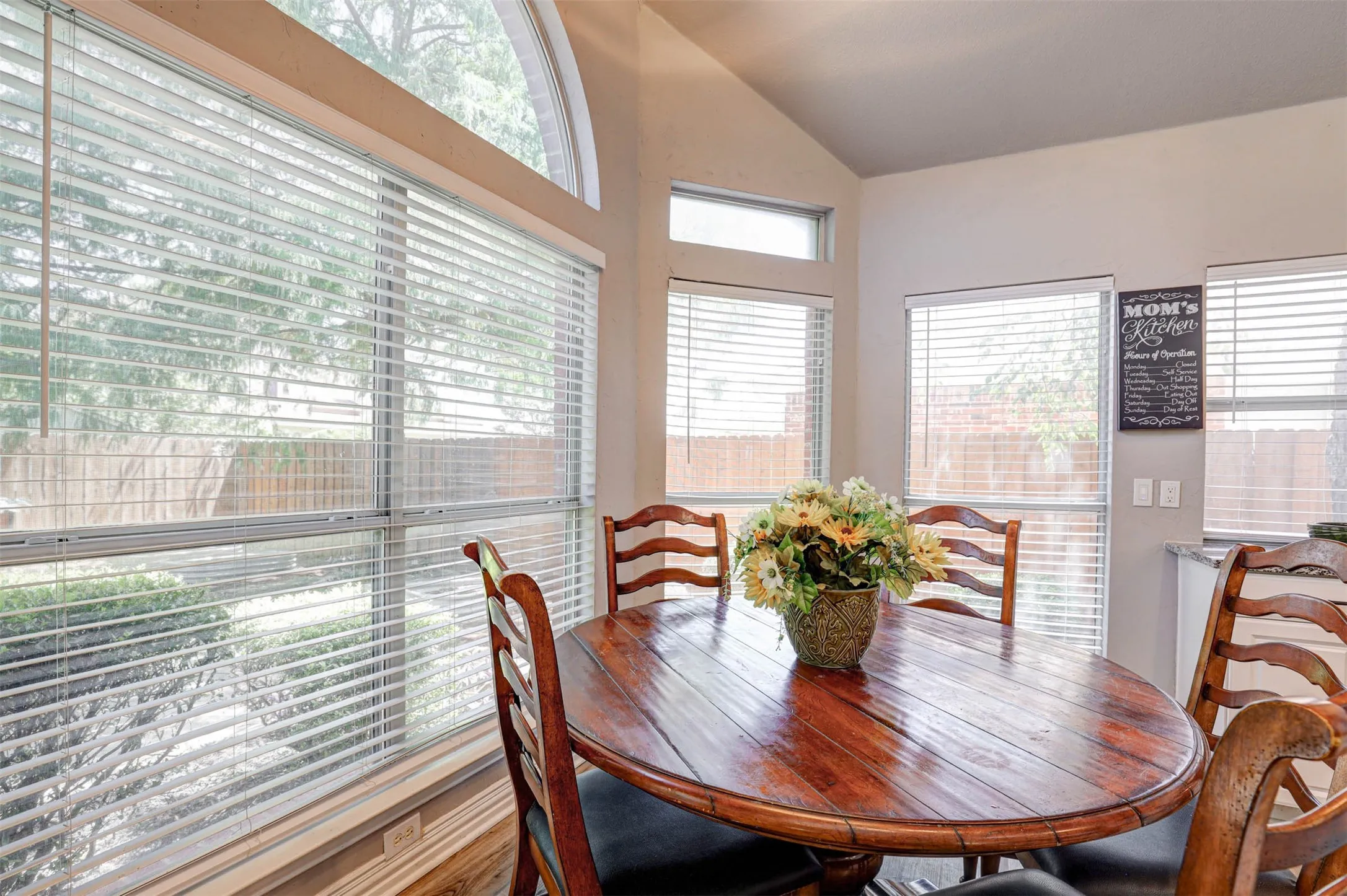 A sunlit breakfast nook framed by a beautiful bay window — a bright and charming spot to start your day.