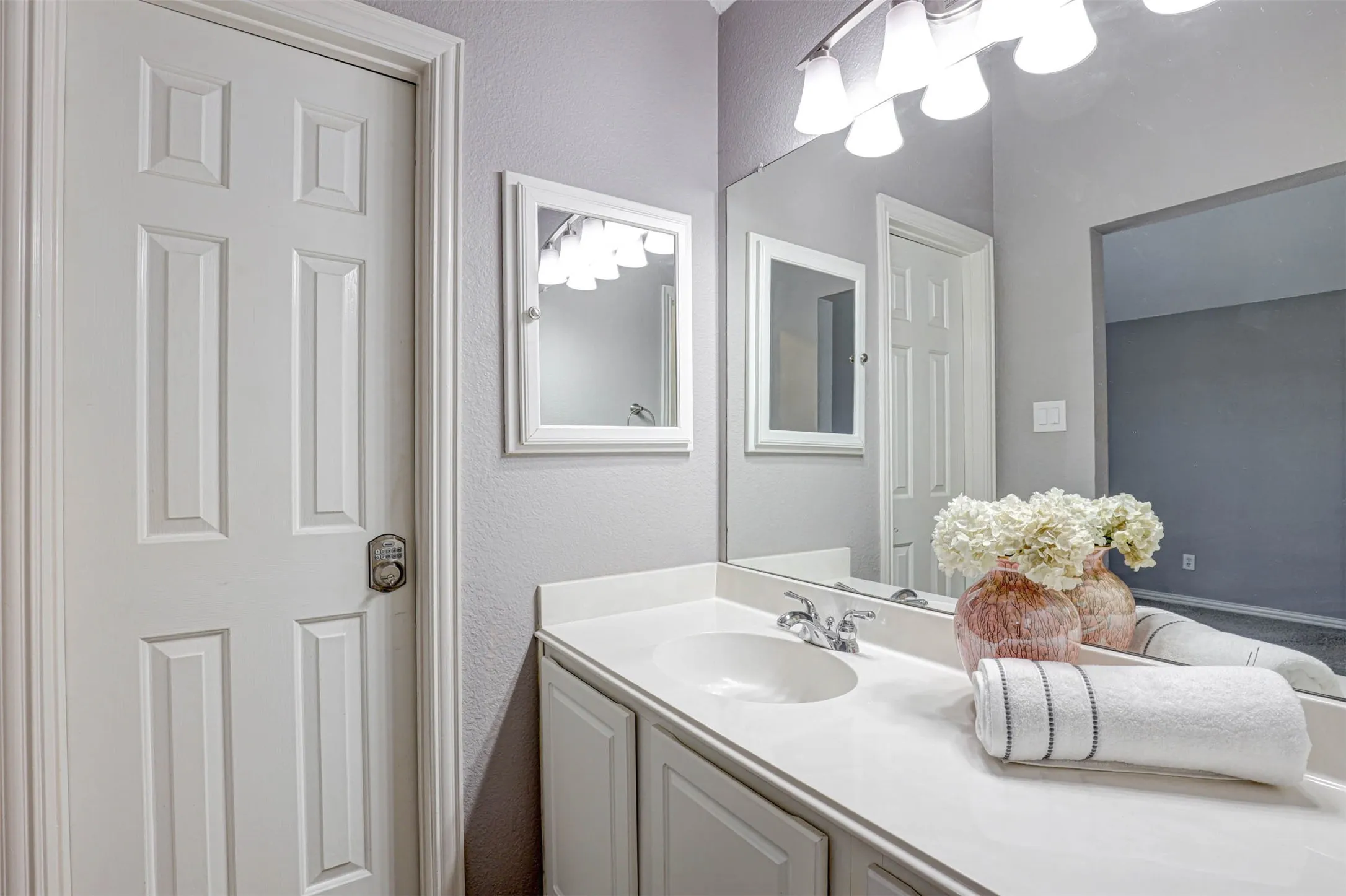 A private vanity conveniently opens to the bedroom for added comfort and privacy.