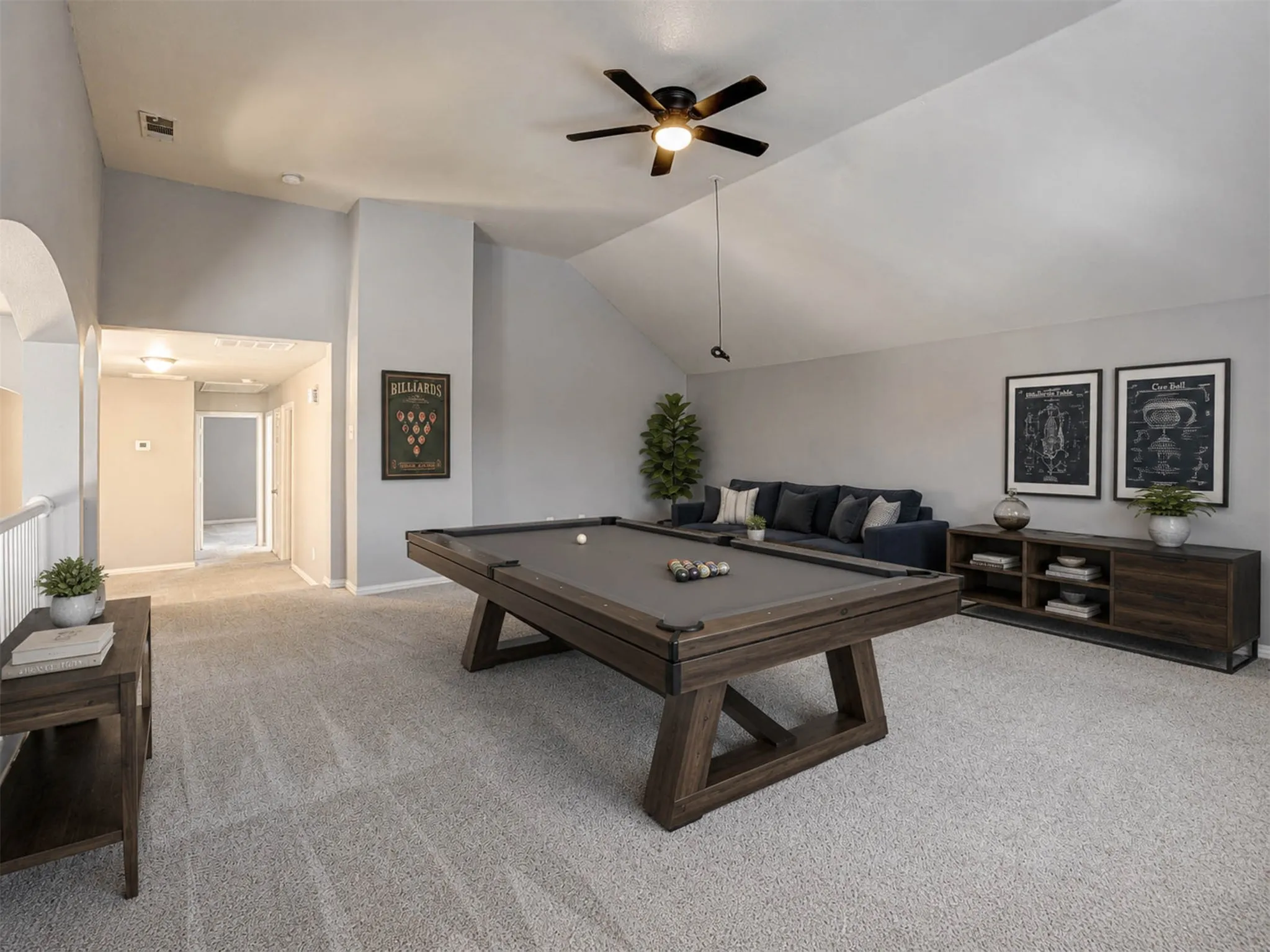 The game room is ready for fun, featuring plenty of space for a full-size pool table and more. (Staged)
