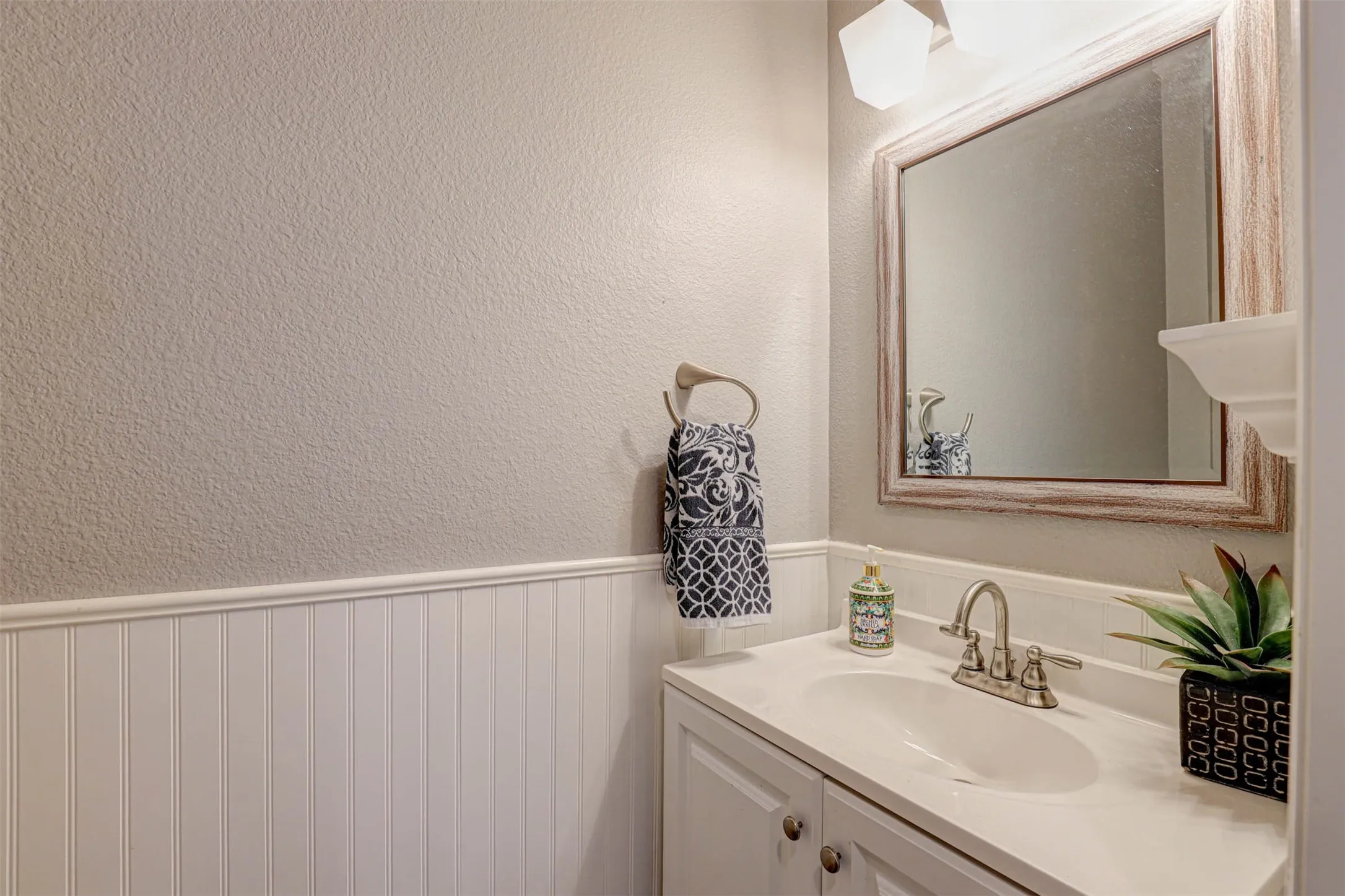 A conveniently located downstairs half bath, perfect for guests.