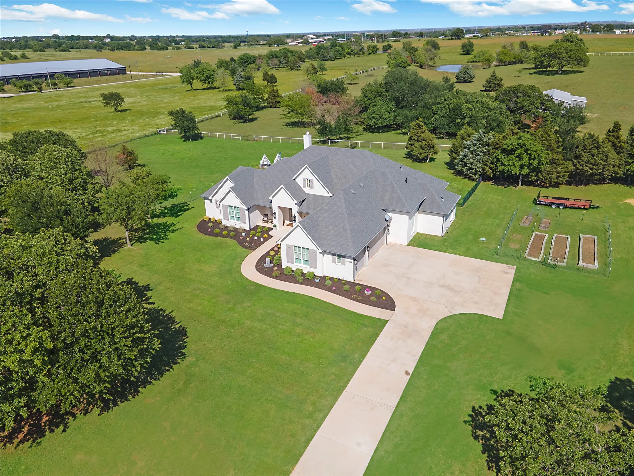 10 acres fully fenced and cross-fenced.  There is a hay barn and a pond located at the back of the property.
