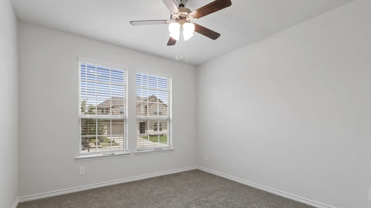 Recessed lighting, ceiling fan with light fixture, dual windows with blinds, and carpeted flooring