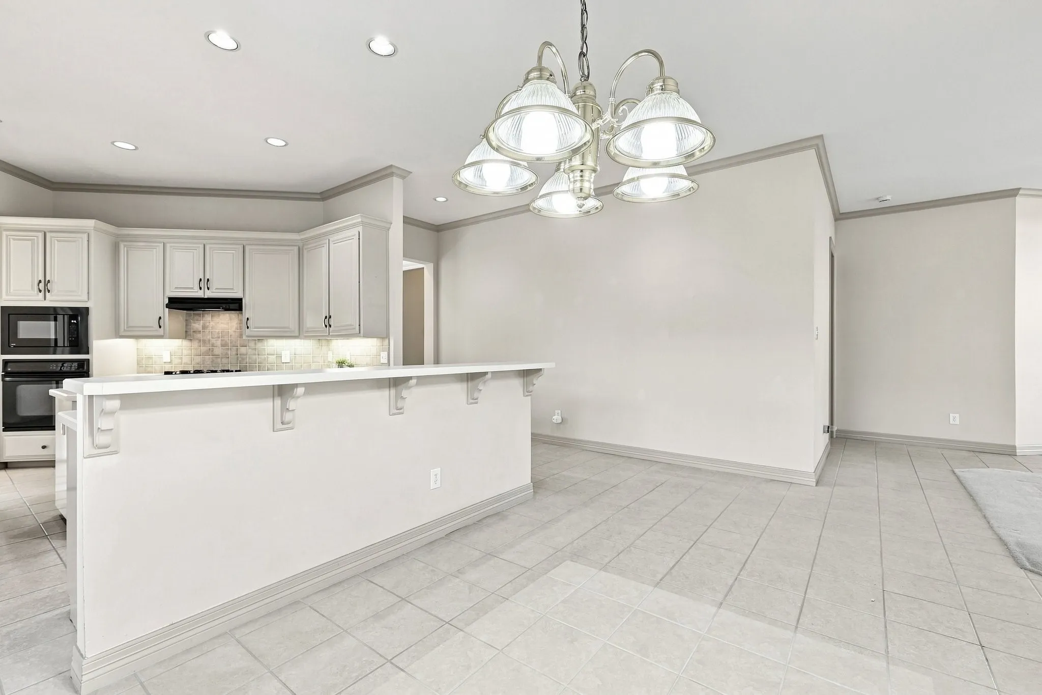 Kitchen featuring recessed lighting, a built-in oven, and a tiled backsplash