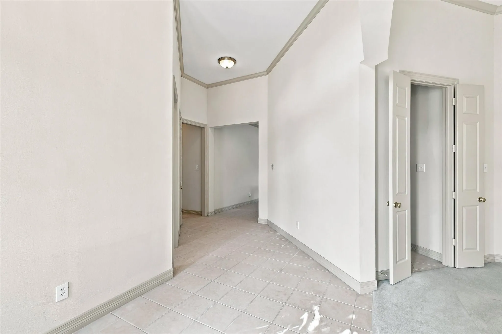 From front door toward bedrooms and family room, kitchen through the double doors from dining room