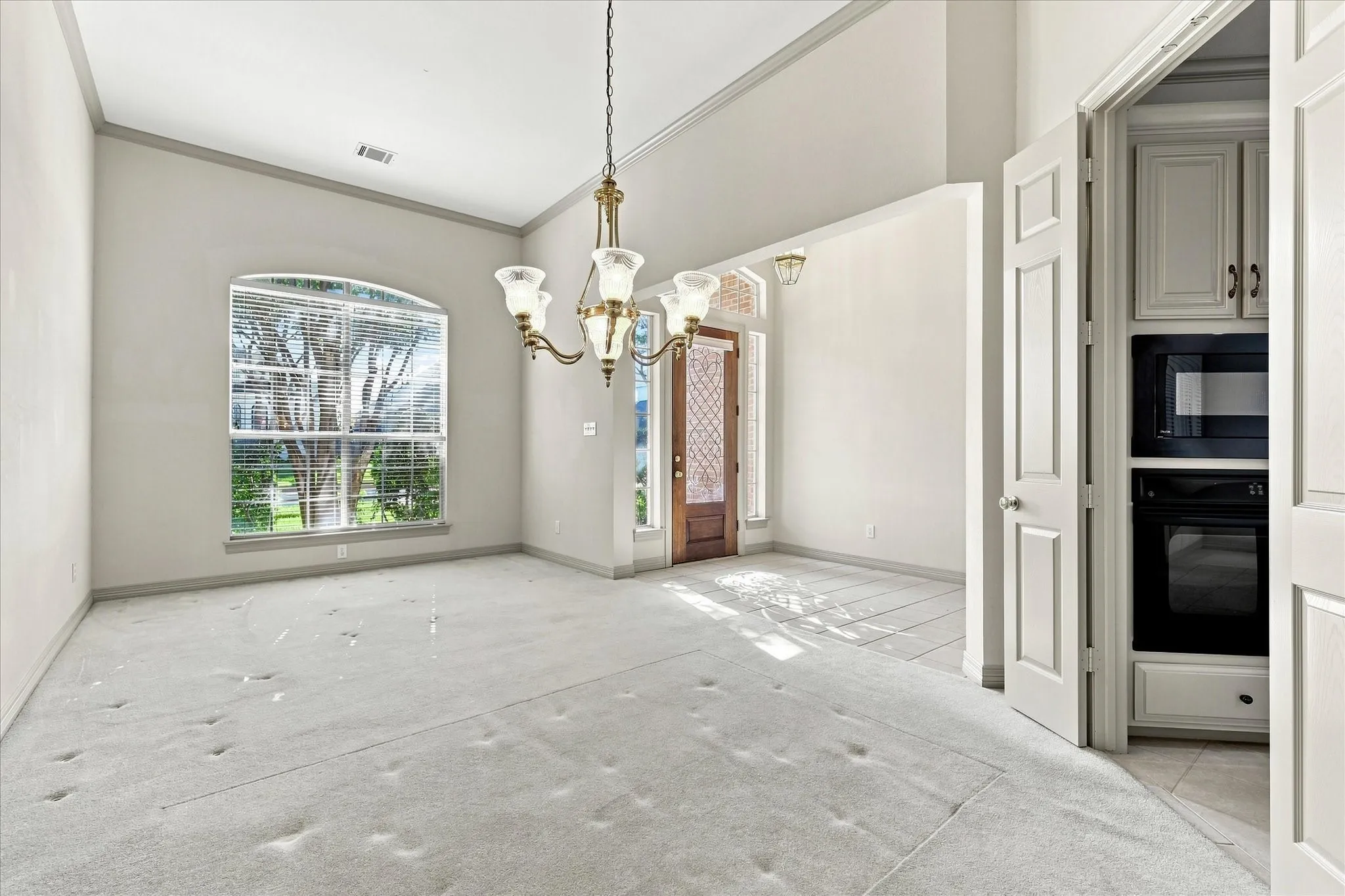 Living area with dining area off entry and kitchen