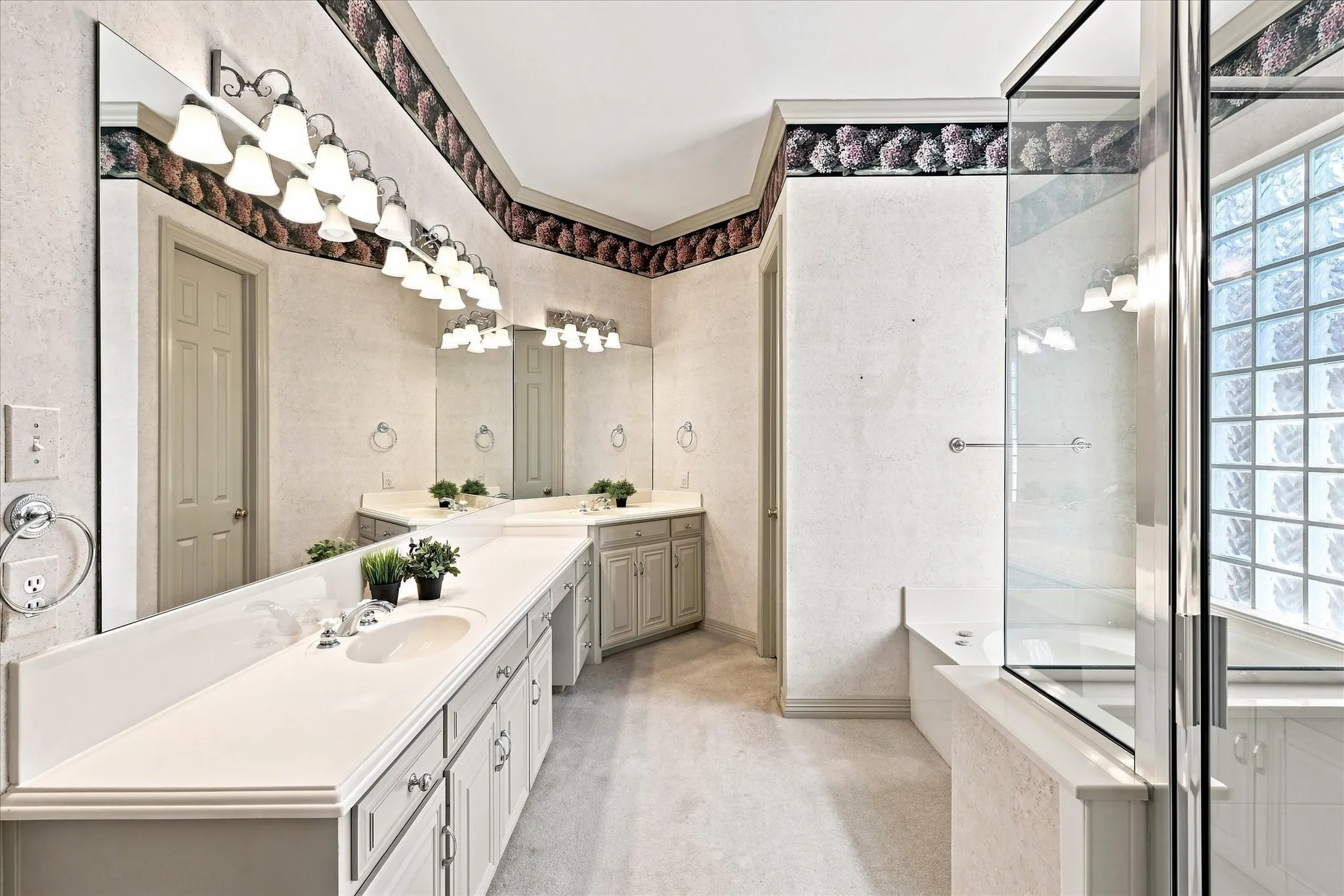 Separate shower and garden tub, abundant storage