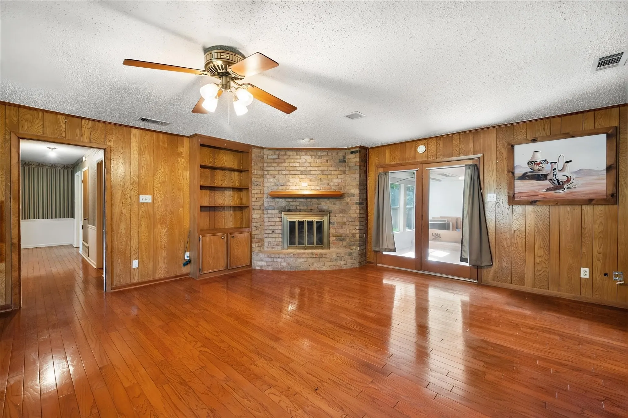 Double glass doors out to unfinished sunroom