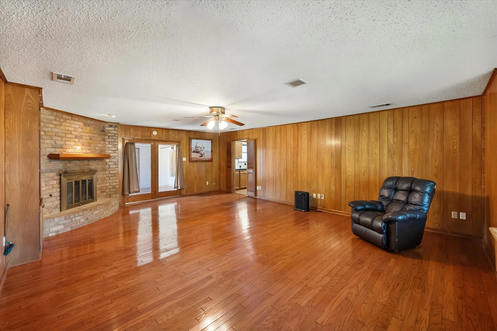 Wood burning fireplace and beautiful hard wood flooring