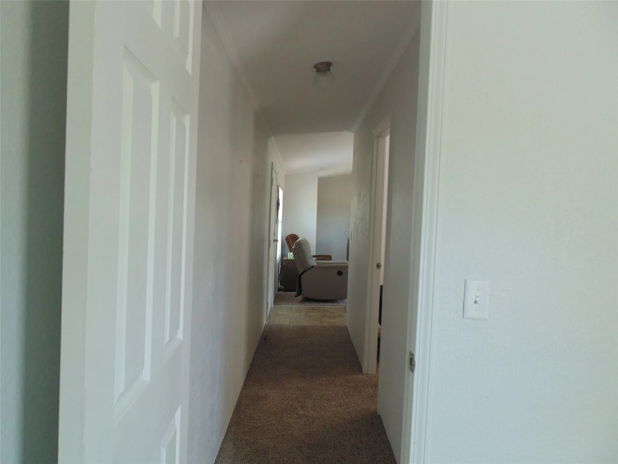 Hallway to other 2 bedrooms and bathroom