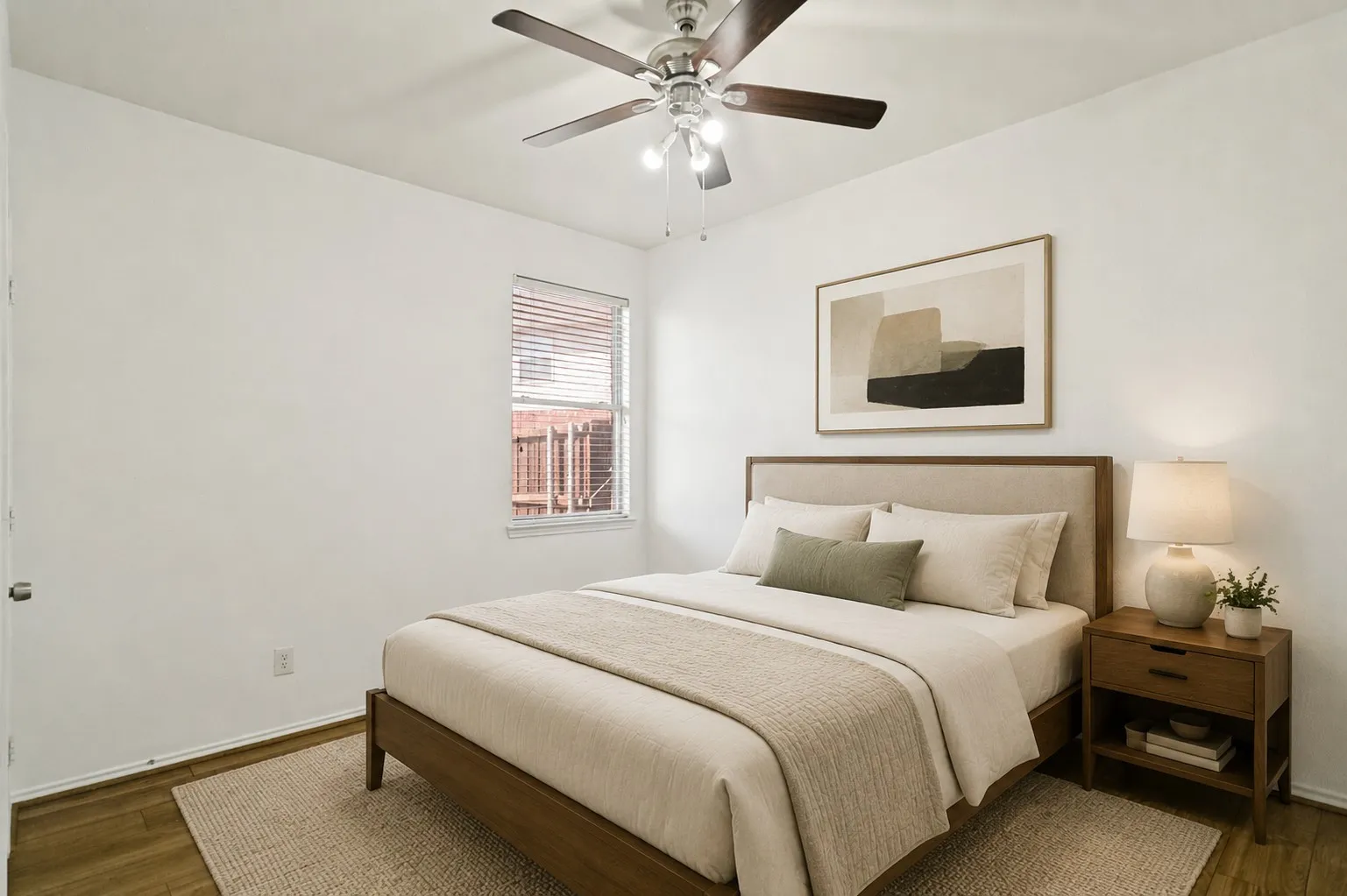 Wood-finish flooring, ceiling fan with integrated lighting, and a window with blinds