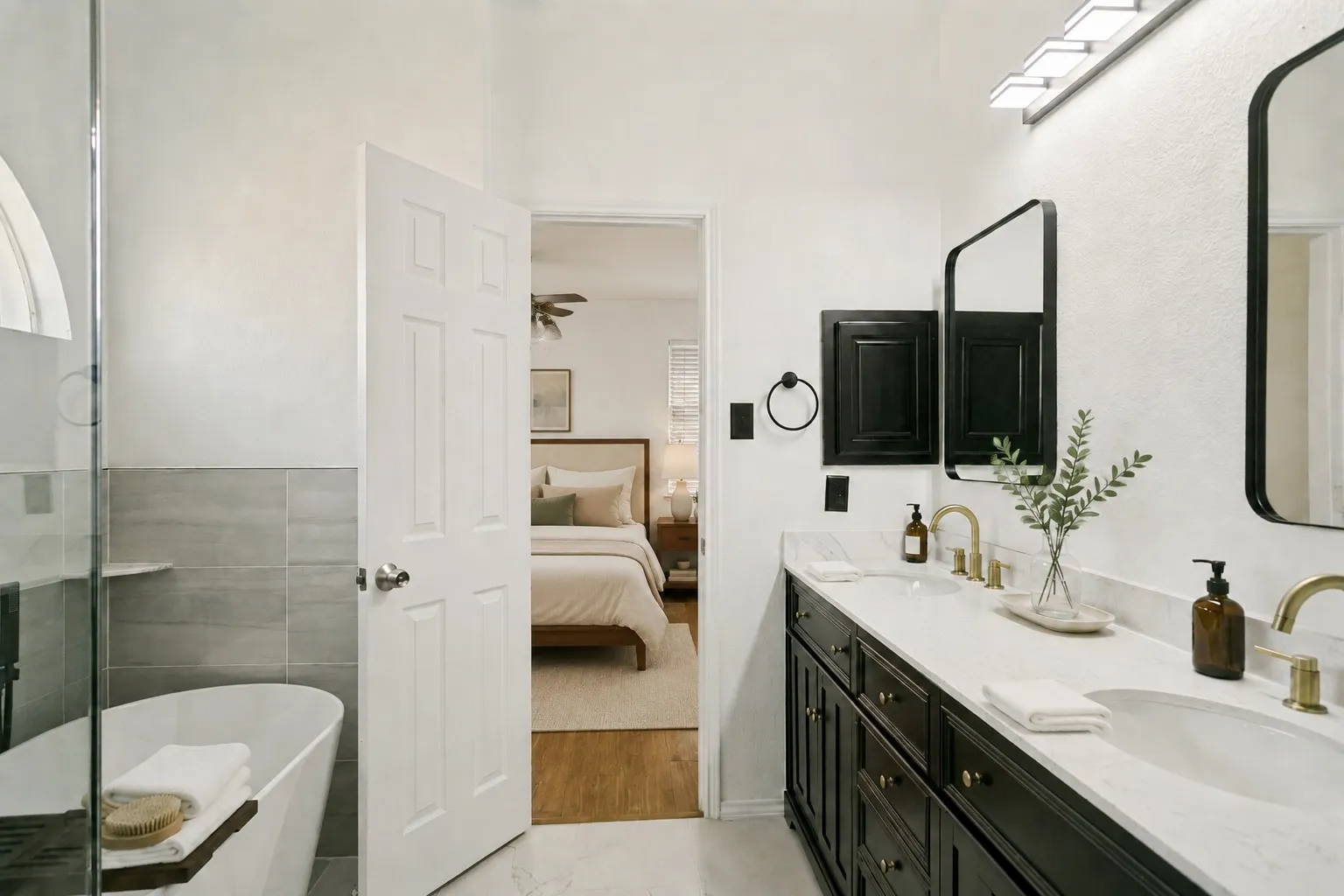 Dual vanity with dark wood-finish cabinetry, white countertop, and gold-finish fixtures