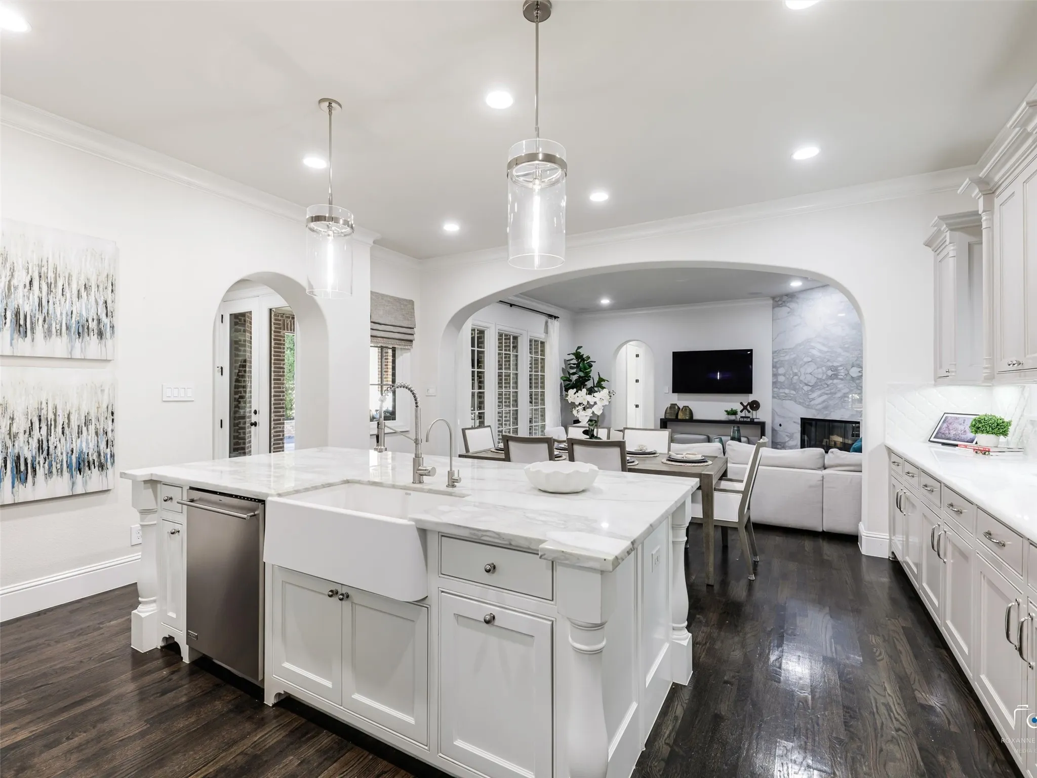 Island with farm sink and dishwasher.