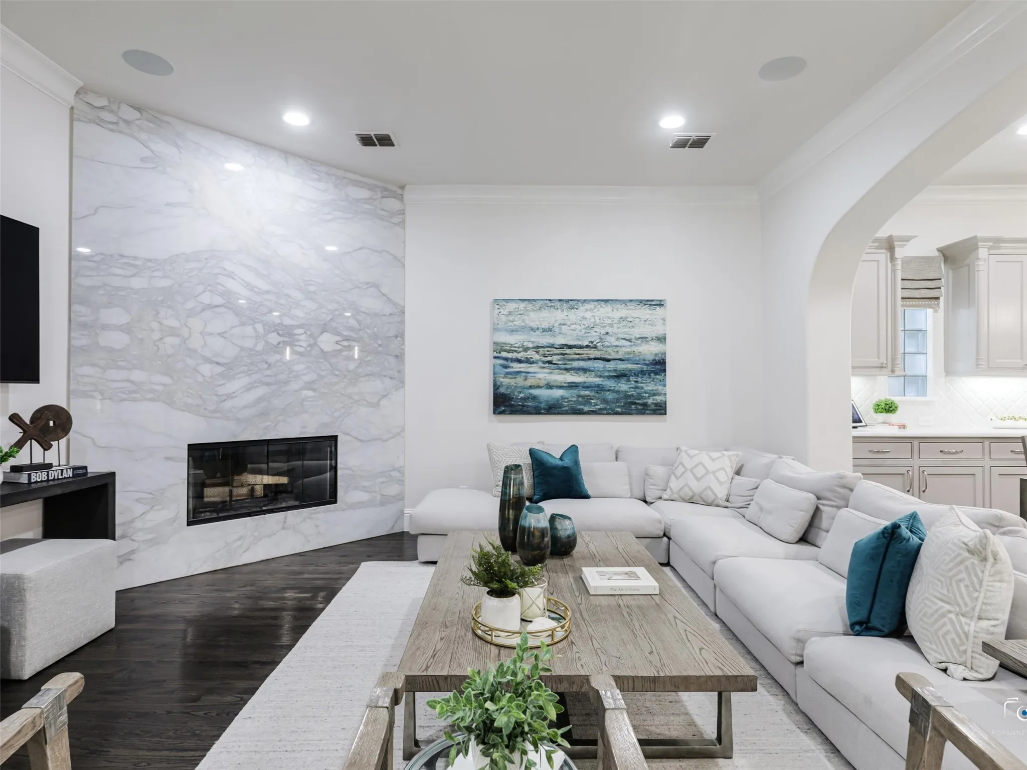 Floor to ceiling fireplace, open floor plan, recessed lighting throughout