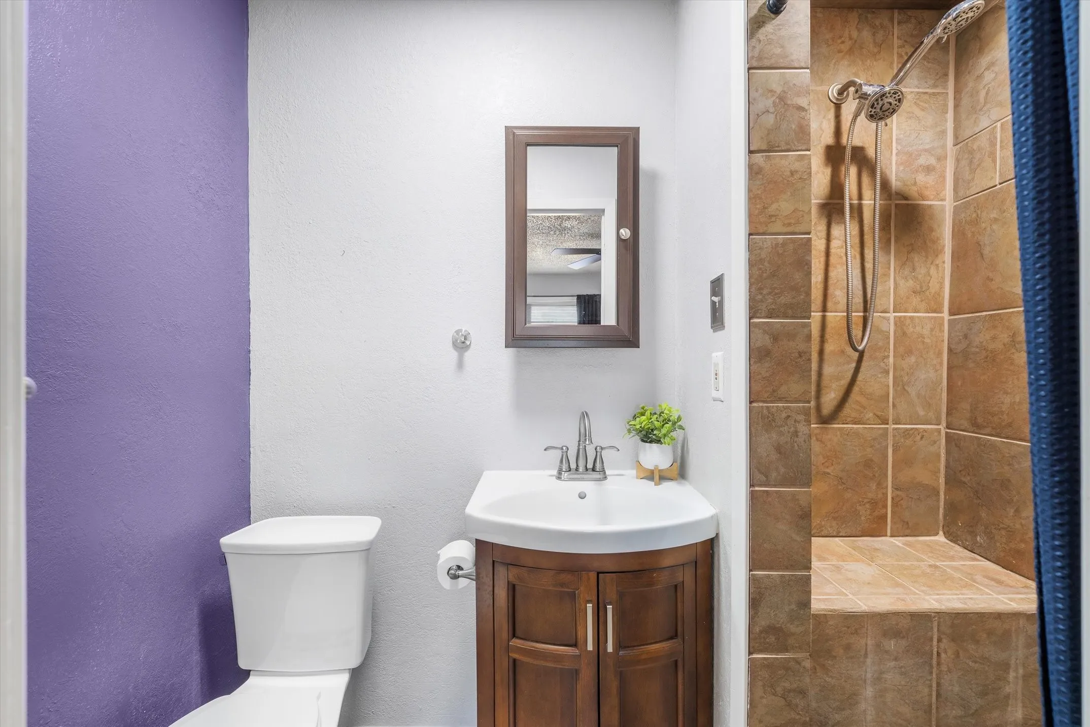 Ensuite bath has a walk in tiled shower with a seat