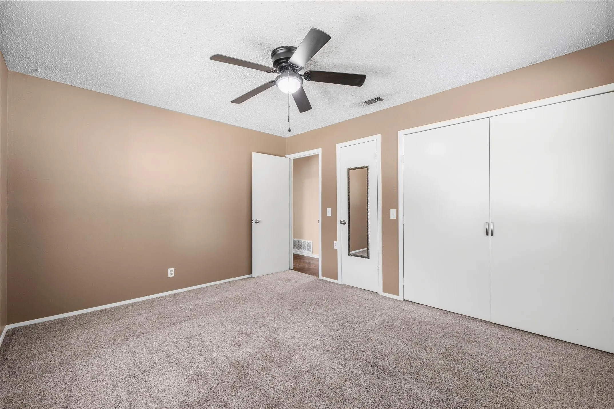 Bedroom 1 with dual closets
