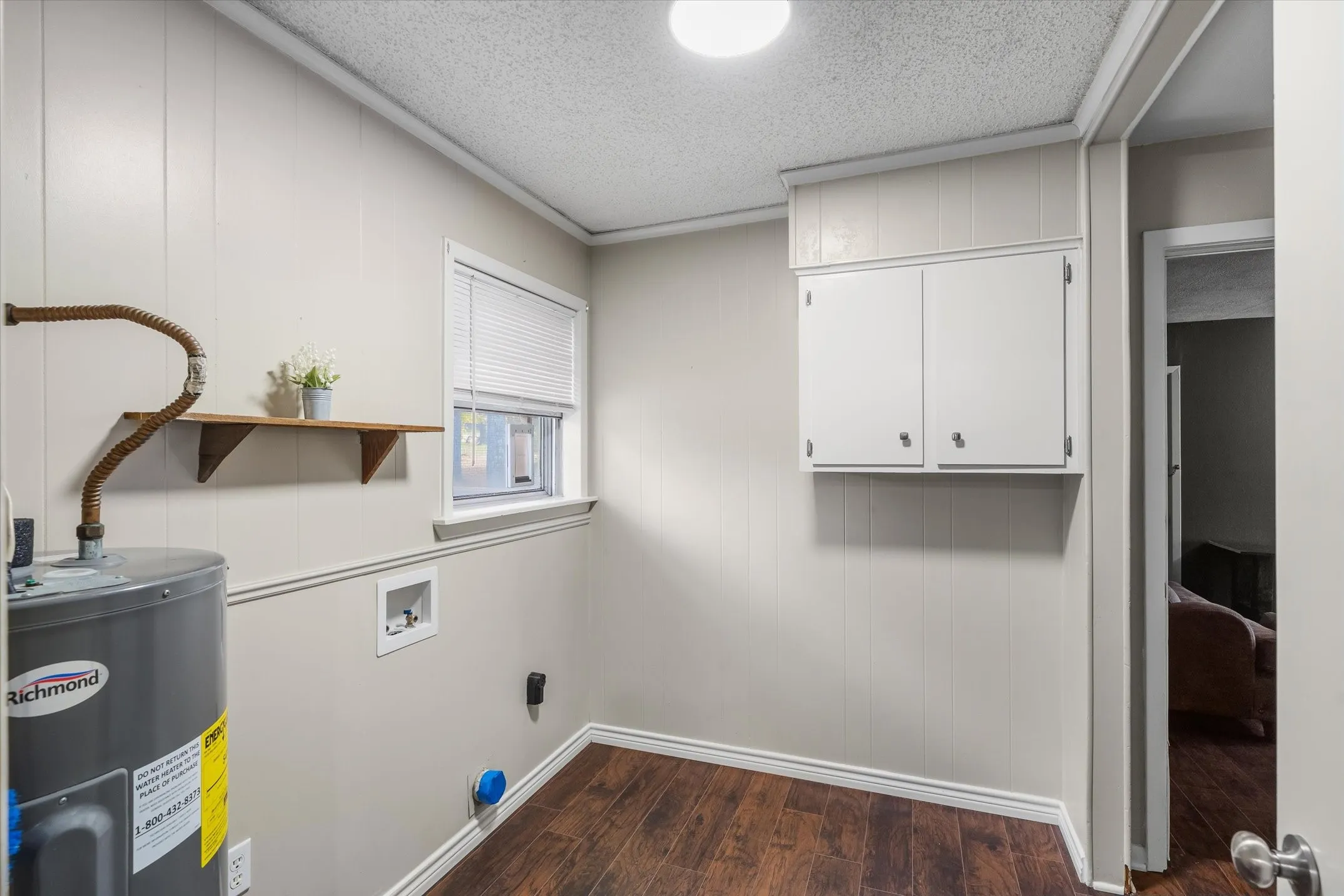 The laundry/utility room is large with space for a pantry, freezer, etc.