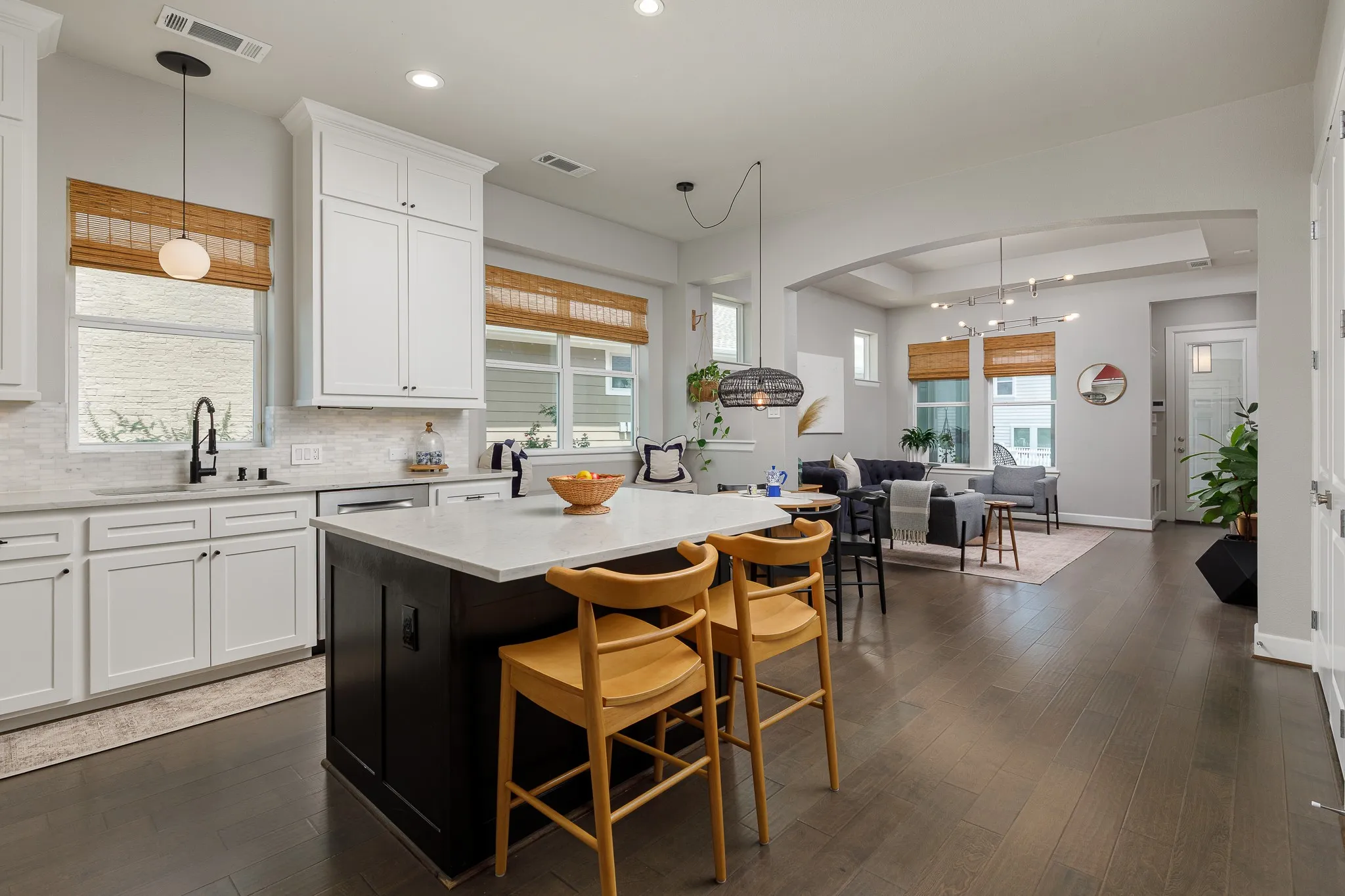 Open, entertaining layout. Light and bright kitchen with white cabinetry.