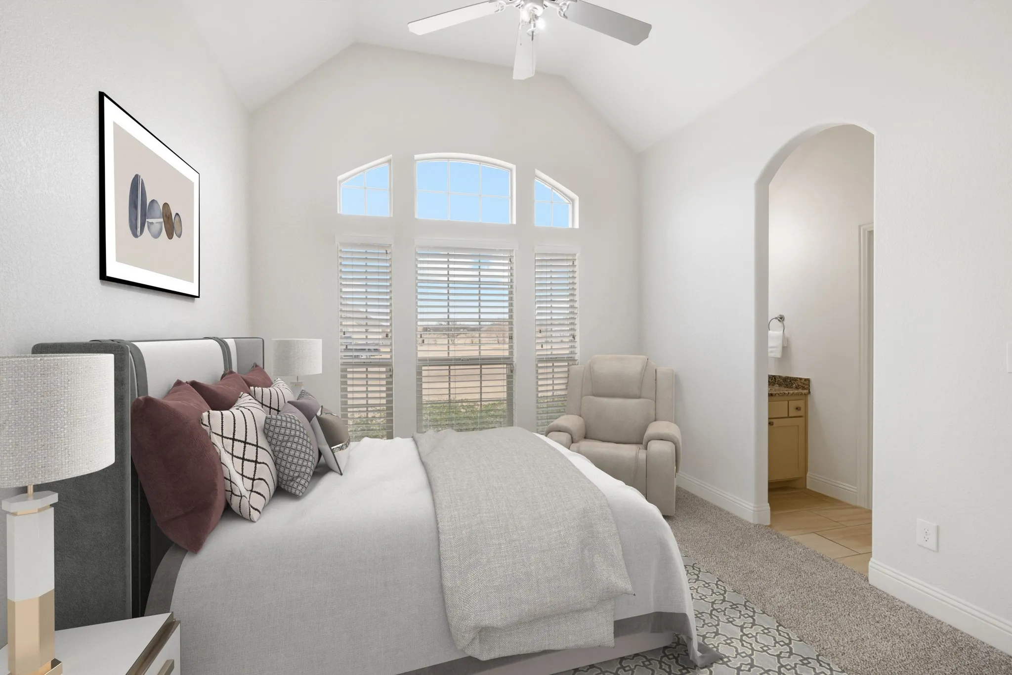 Vaulted ceiling, arched entry, arched window, plantation shutters, and ceiling fan