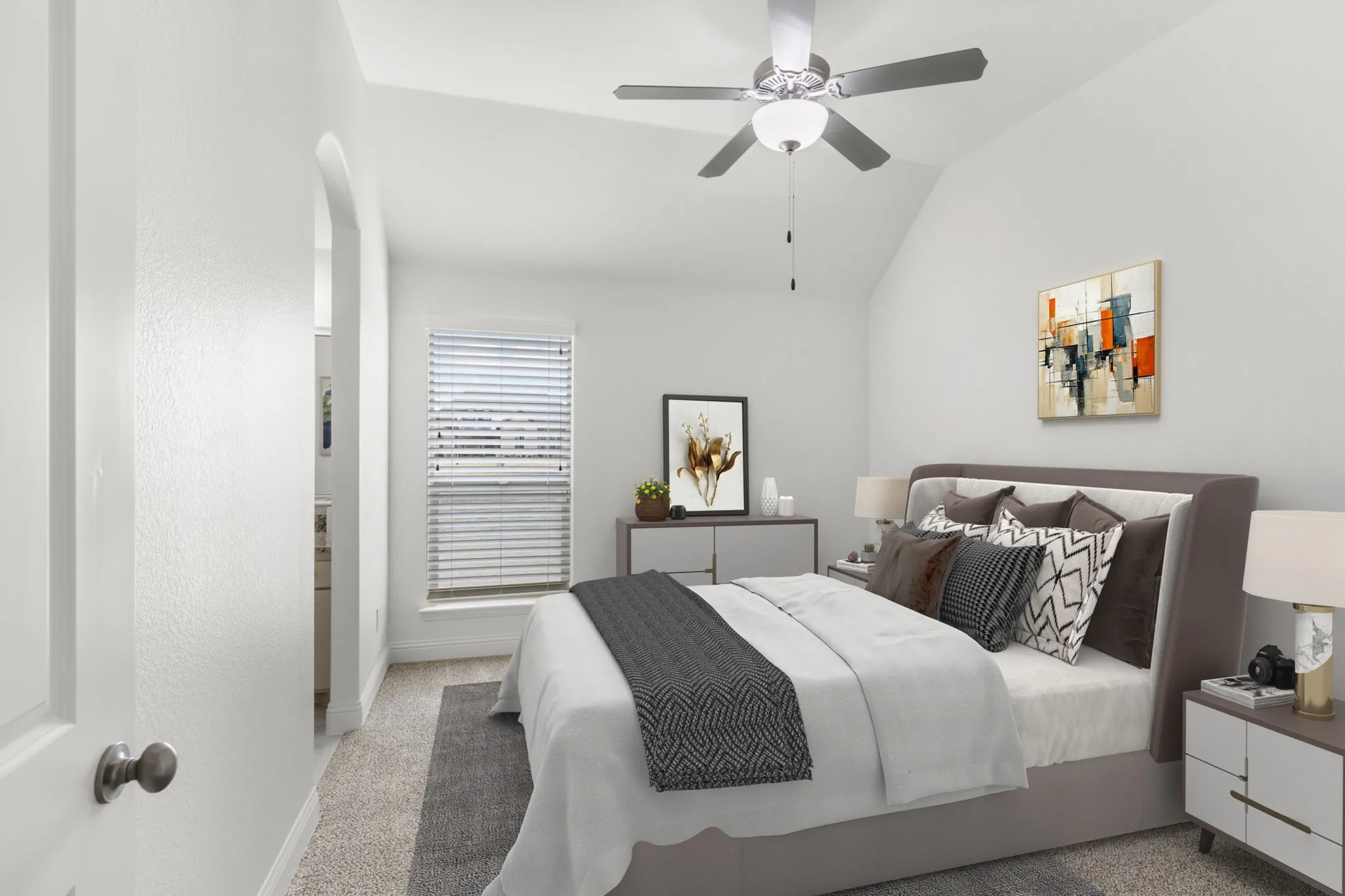 Vaulted ceiling with a ceiling fan, arched doorway, and window with blinds