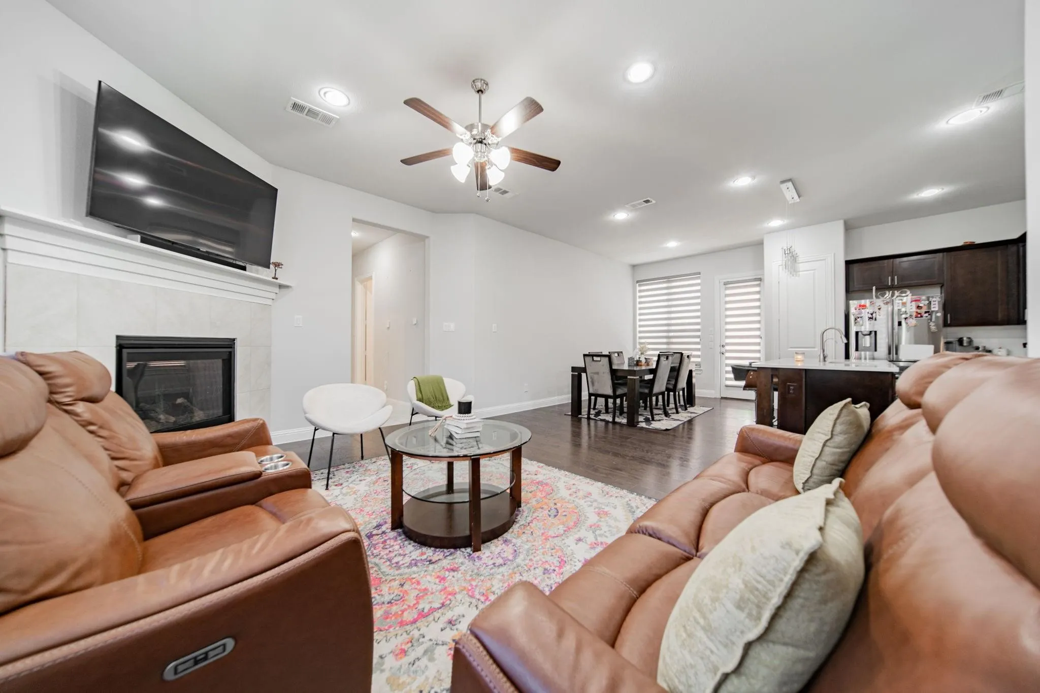 Hardwood-style flooring, recessed lighting, and a ceiling fan