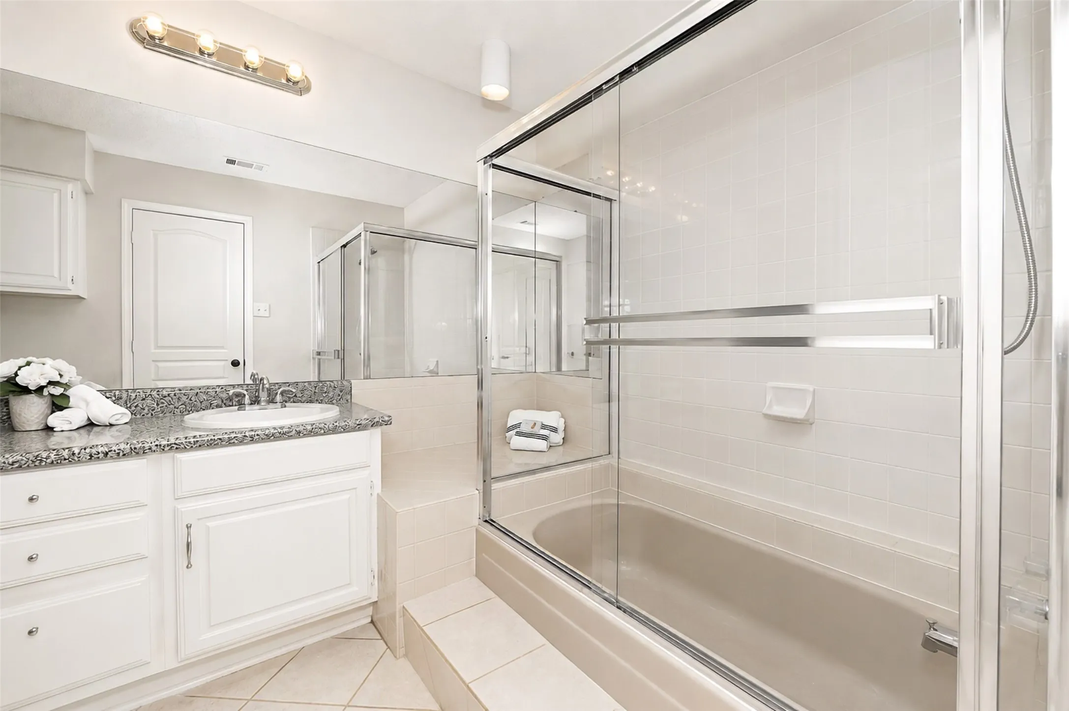 Spacious bath with tub/shower combo.