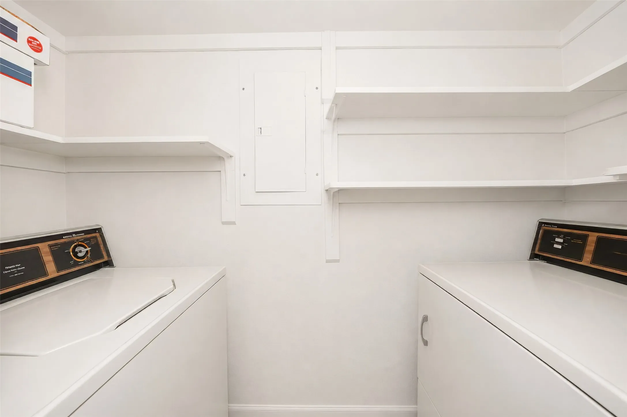The laundry closet offers shelving space, and the washer and dryer will stay.