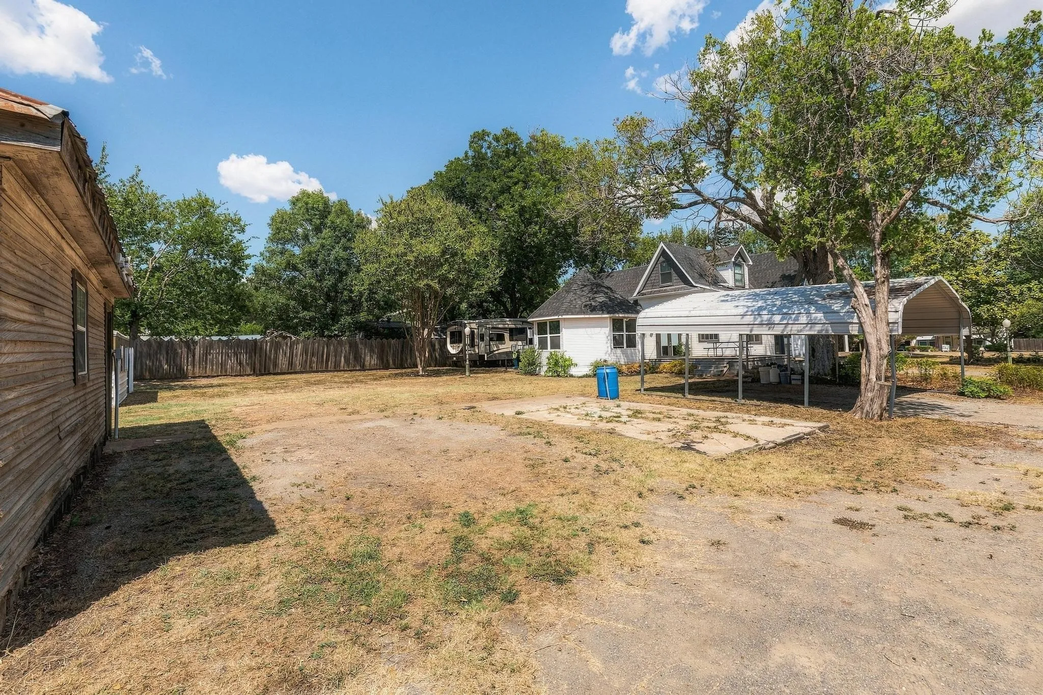 Large yard between garage and home