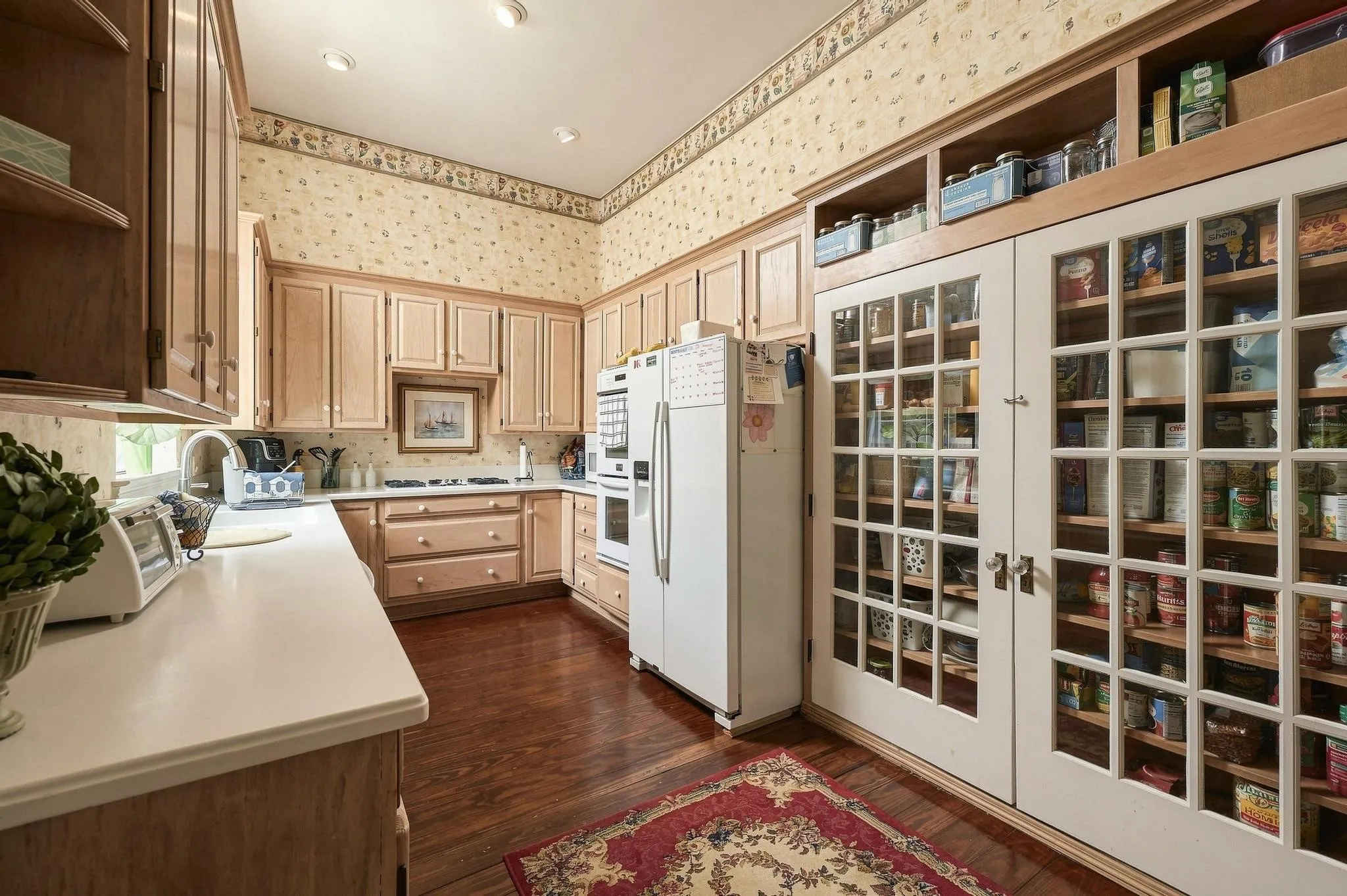 Large custom pantry with French doors
