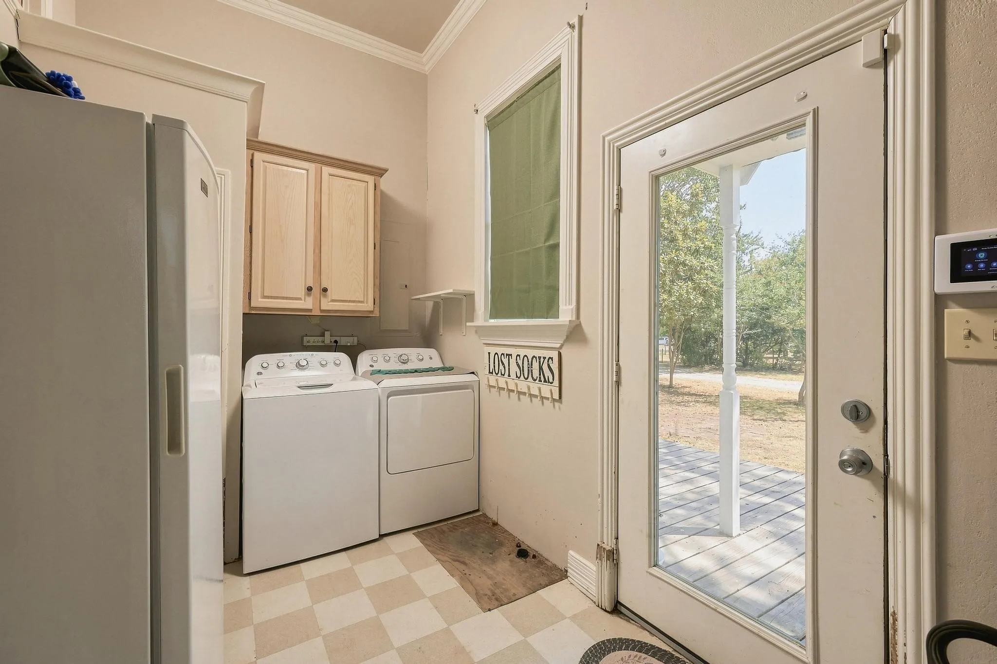 Laundry-Utility room off kitchen with additional pantry room for freezer and separate entry near parking for easy access