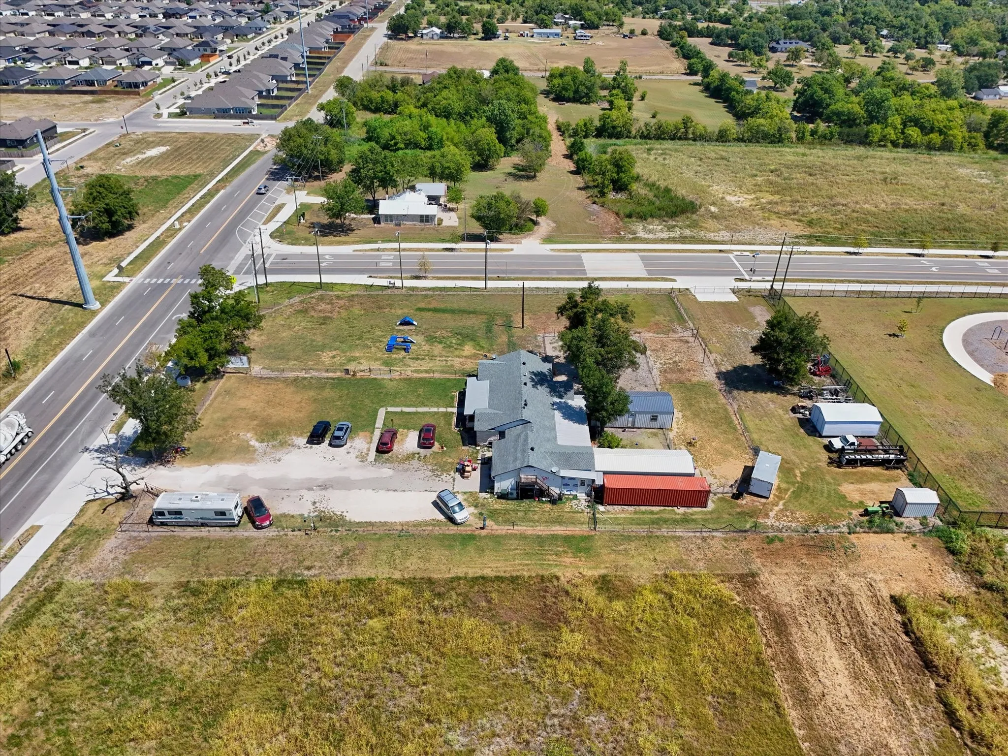 Expansive lot with multiple outbuildings and direct road frontage