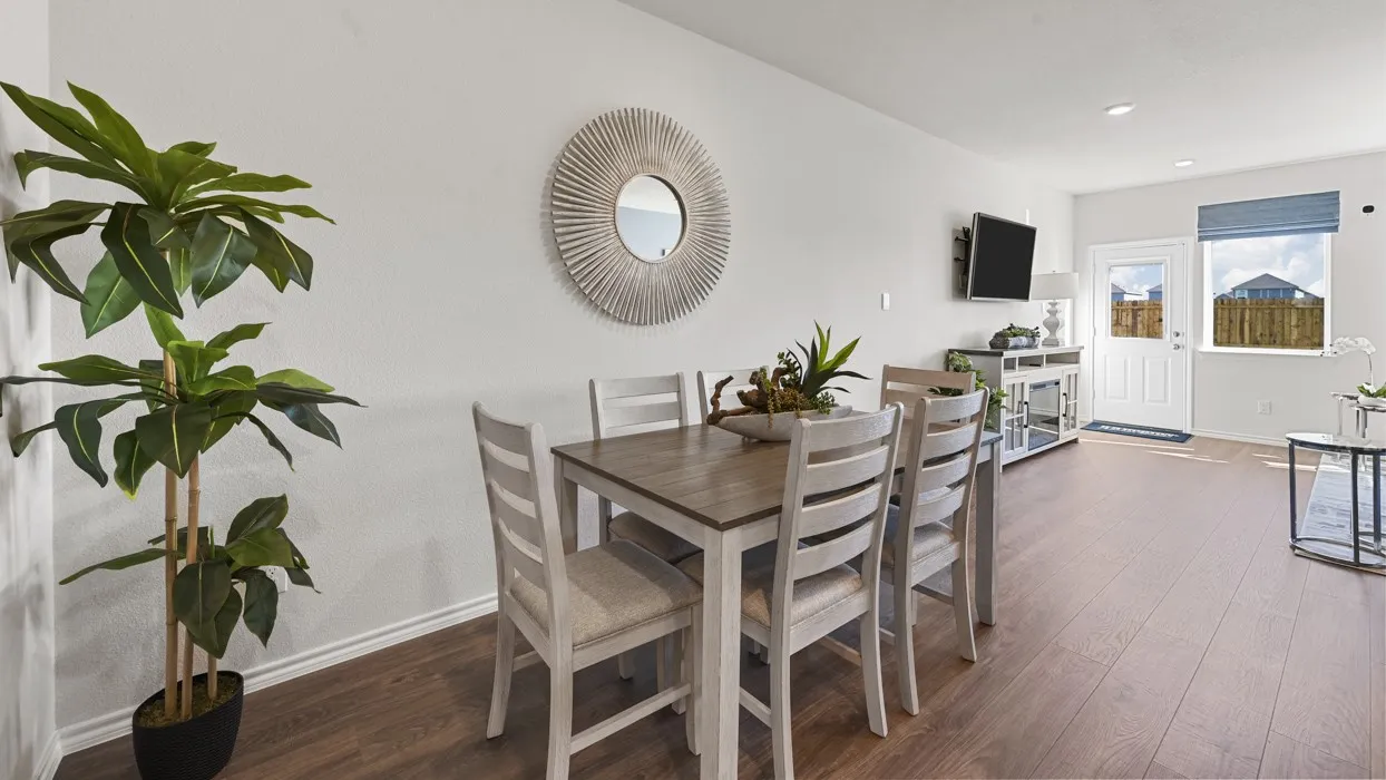 Wood-finish flooring throughout, white walls, and a recessed ceiling light