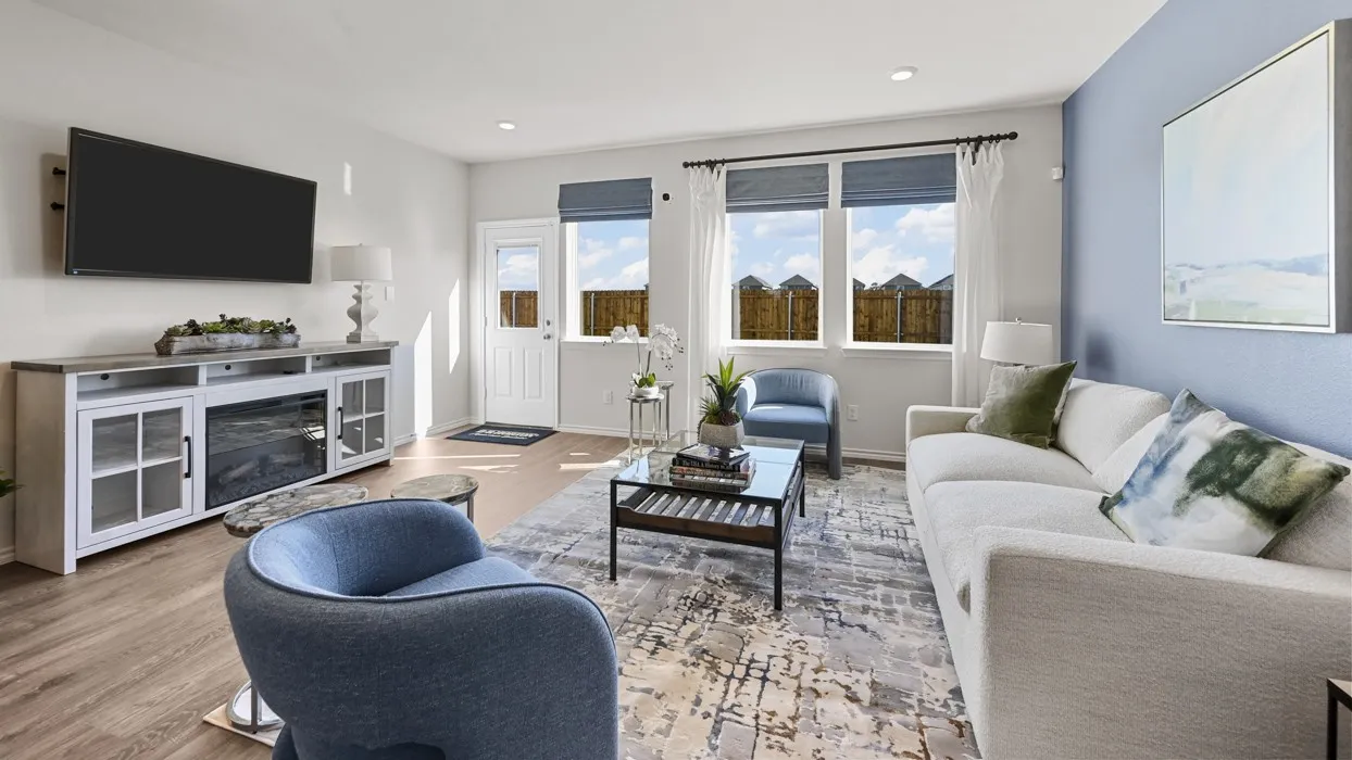 Wood-finish flooring, recessed lighting, and large windows with blinds