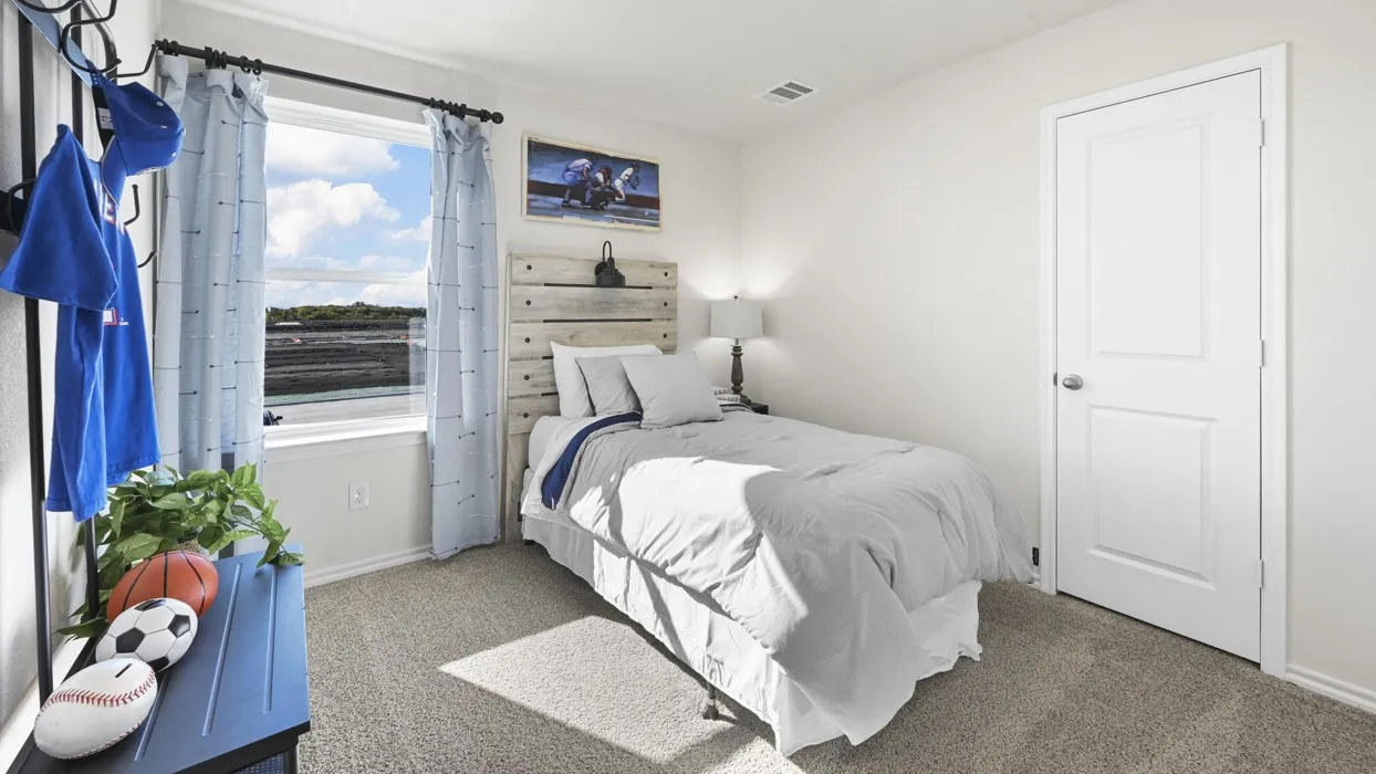 Neutral wall color, carpeted flooring, and a two-panel interior door