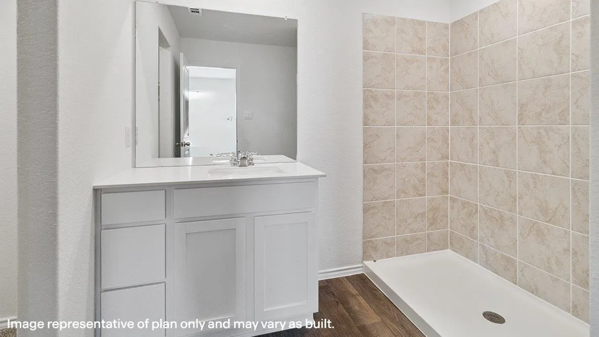 White shaker-style vanity with multiple drawers and cabinet storage, under-mount sink, and polished chrome faucet