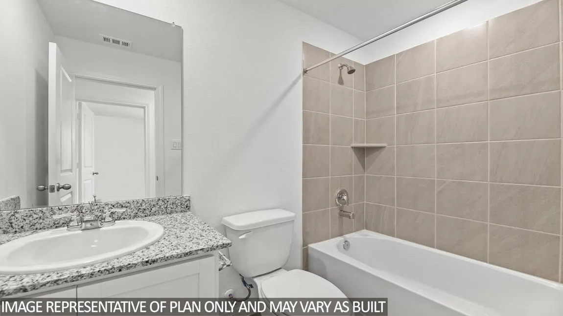 Vanity with speckled countertop, oval undermount sink, and chrome fixtures