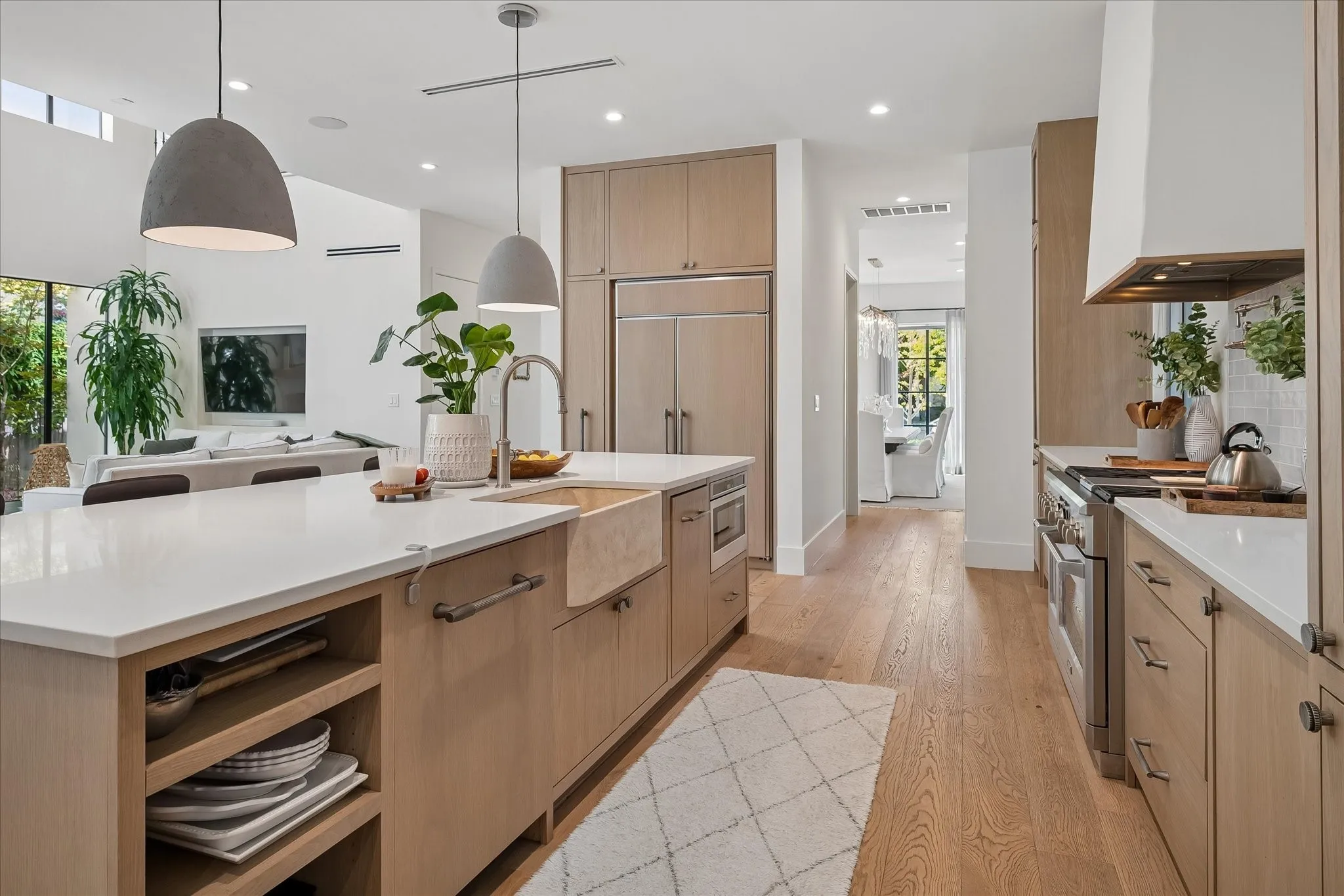 Opens to Great Room, pantry and guest half bath