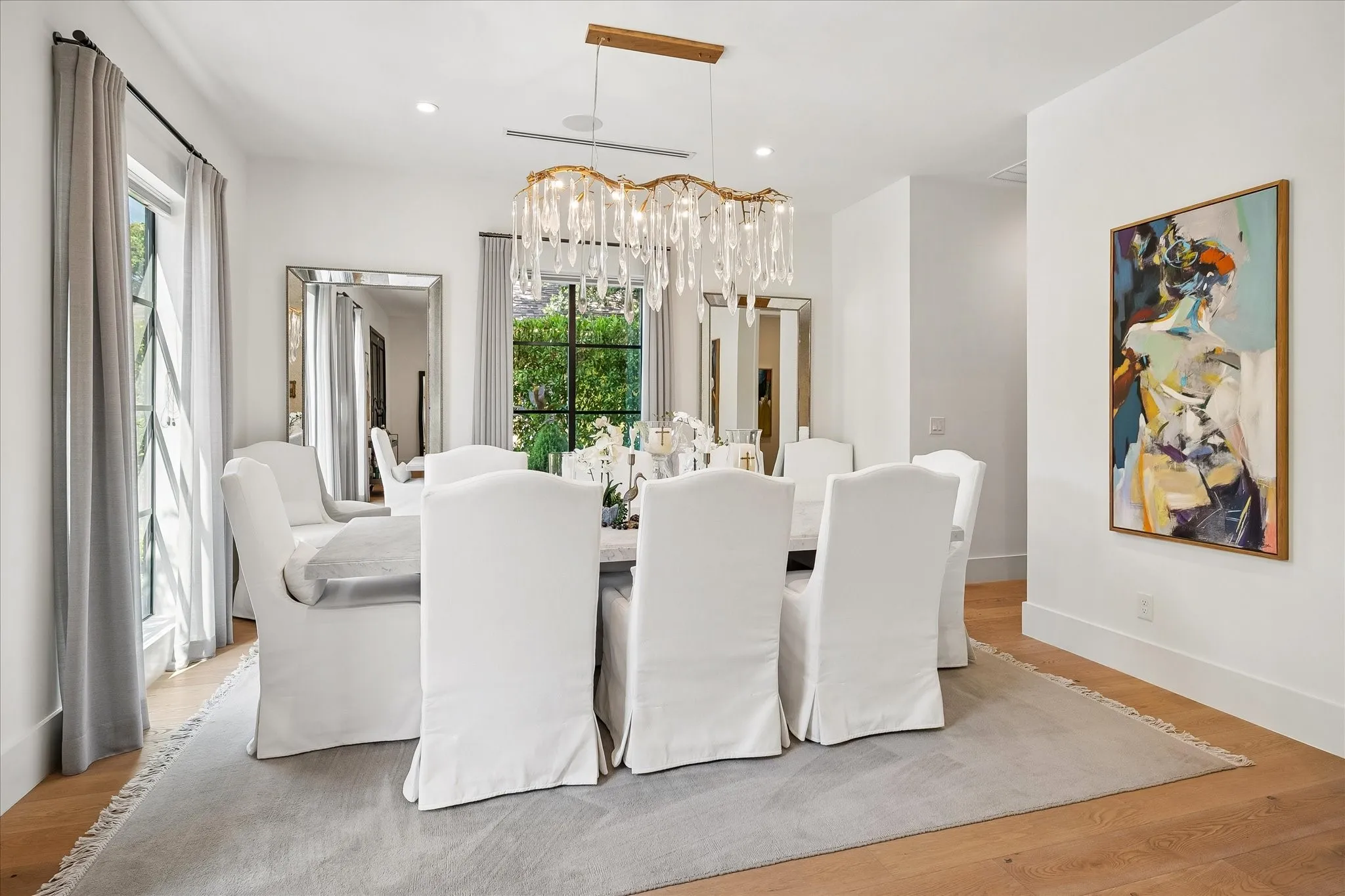 Formal Dining boasts large windows, designer chandelier