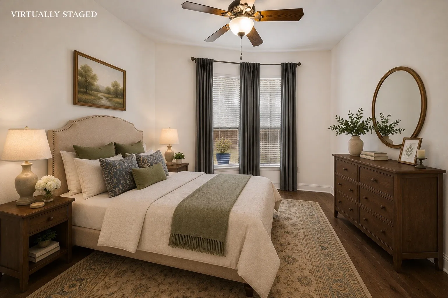 This spacious secondary bedroom offers soaring ceilings, rich hardwood floors, abundant natural light, and a ceiling fan, creating a comfortable retreat for family or guests.