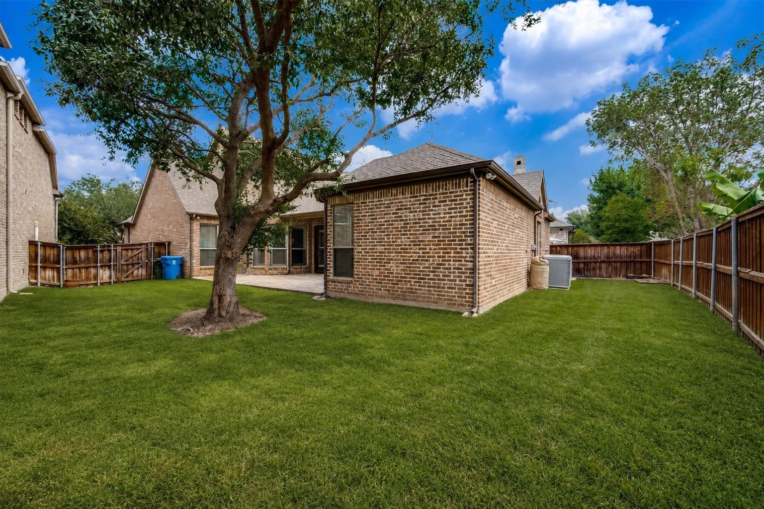 Enjoy a spacious, private backyard featuring mature shade trees, lush green lawn, and plenty of room for pets, play, or future outdoor living. The fully fenced yard provides the perfect setting for entertaining, relaxing, and enjoying the outdoors year-round.