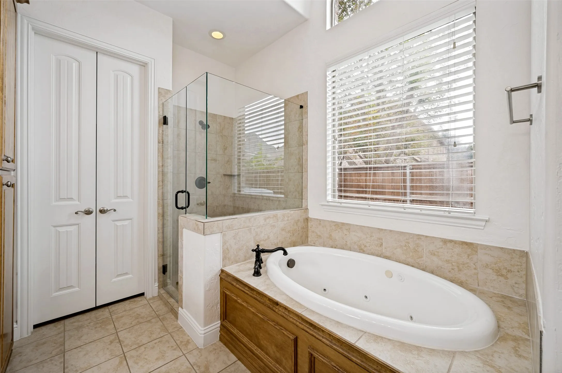 Indulge in the luxurious primary ensuite featuring dual vanities, a relaxing soaking tub, a spacious walk-in shower, elegant finishes, and abundant storage—creating a true spa-like retreat.