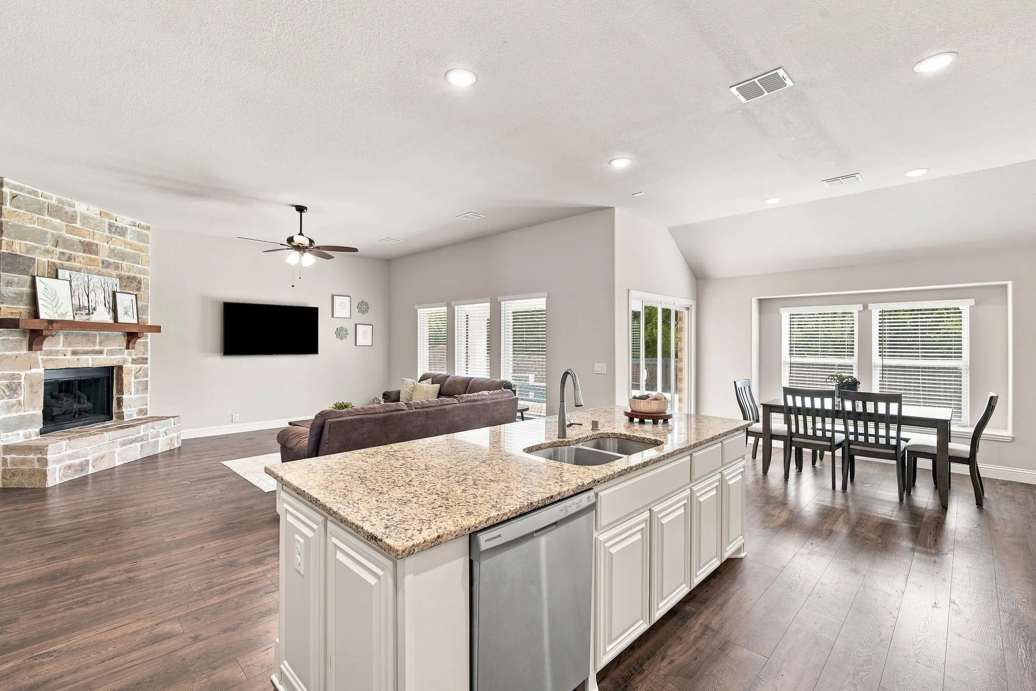 The gourmet island kitchen serves as the heart of the home