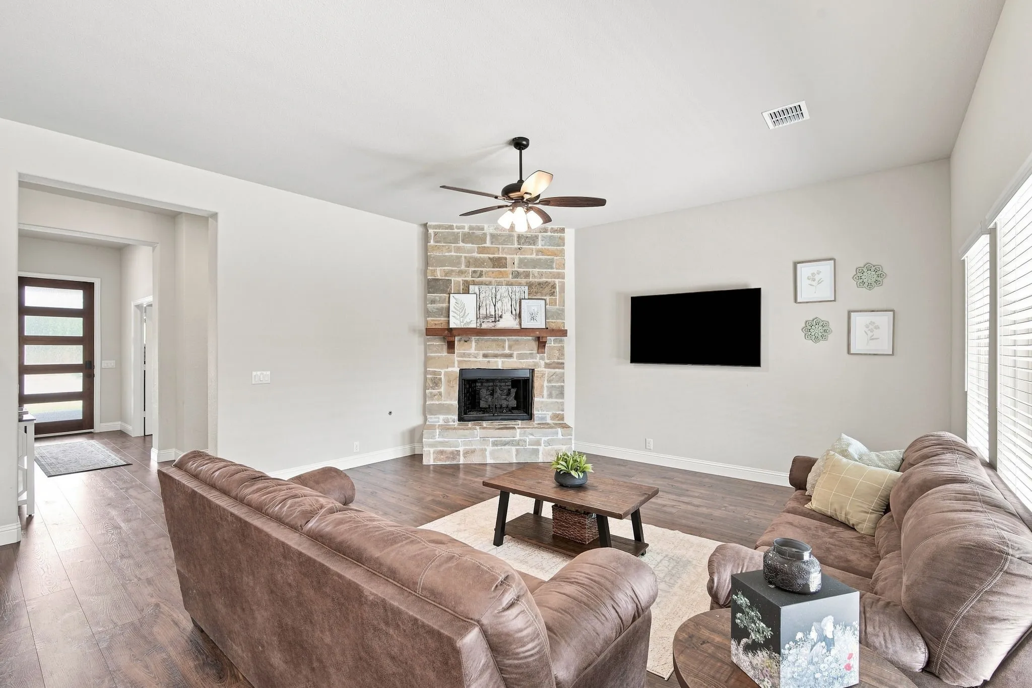 Open floor plan filled with natural light and upscale finishes