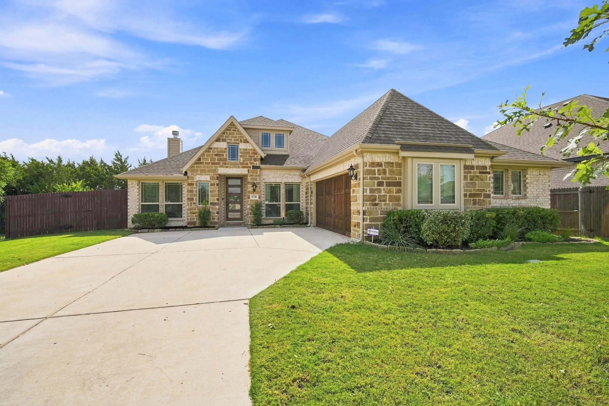 Striking J-swing driveway offers a beautiful elevation