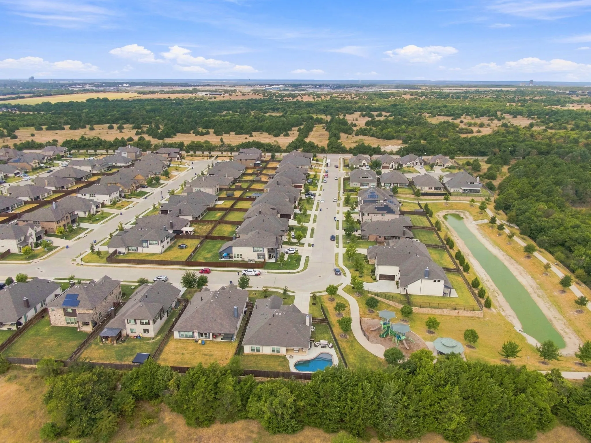 The community walking trail and scenic pond add to the attractiveness of this home