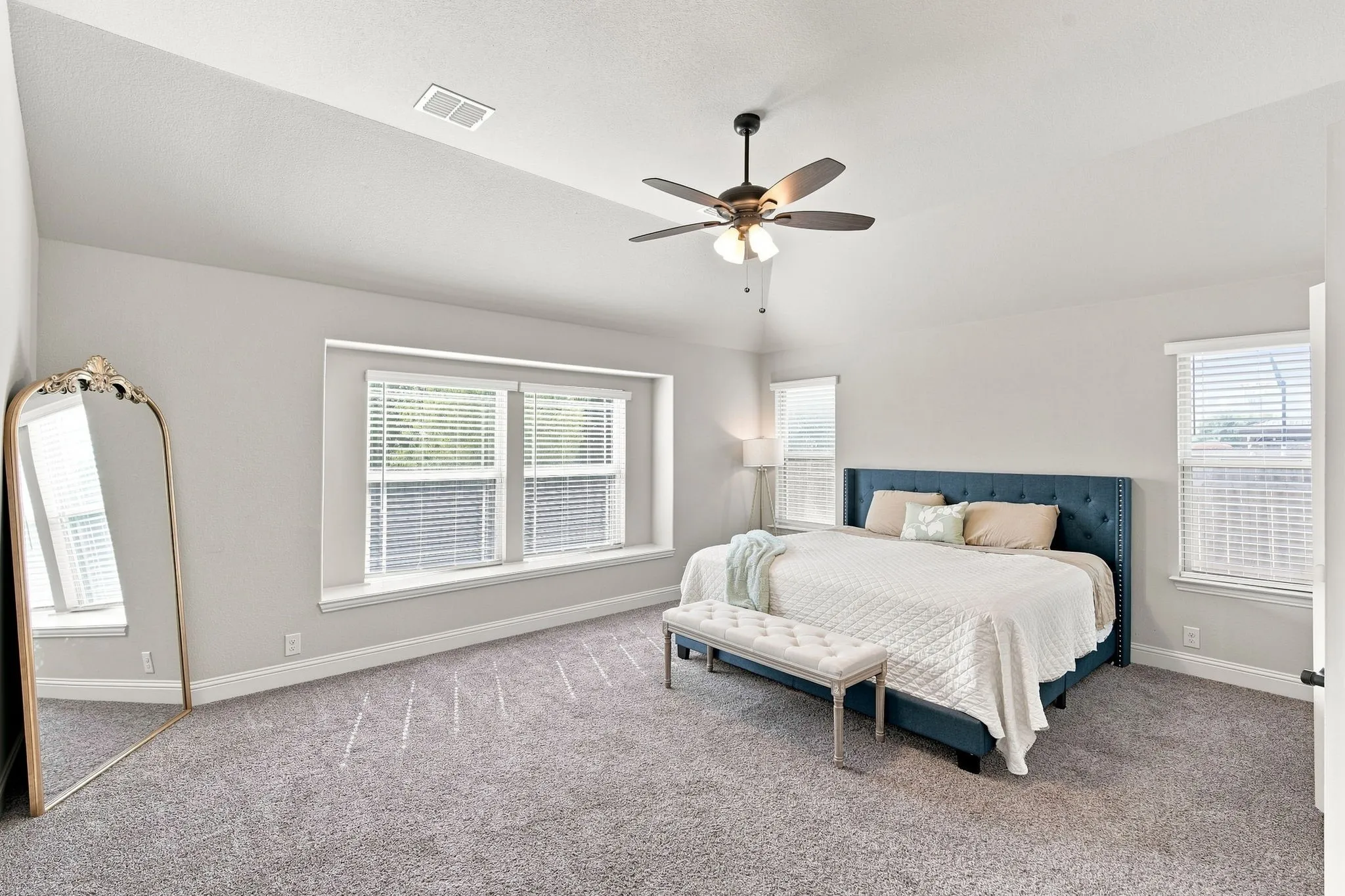 Enjoy spacious and cozy vibes in your primary bedroom
