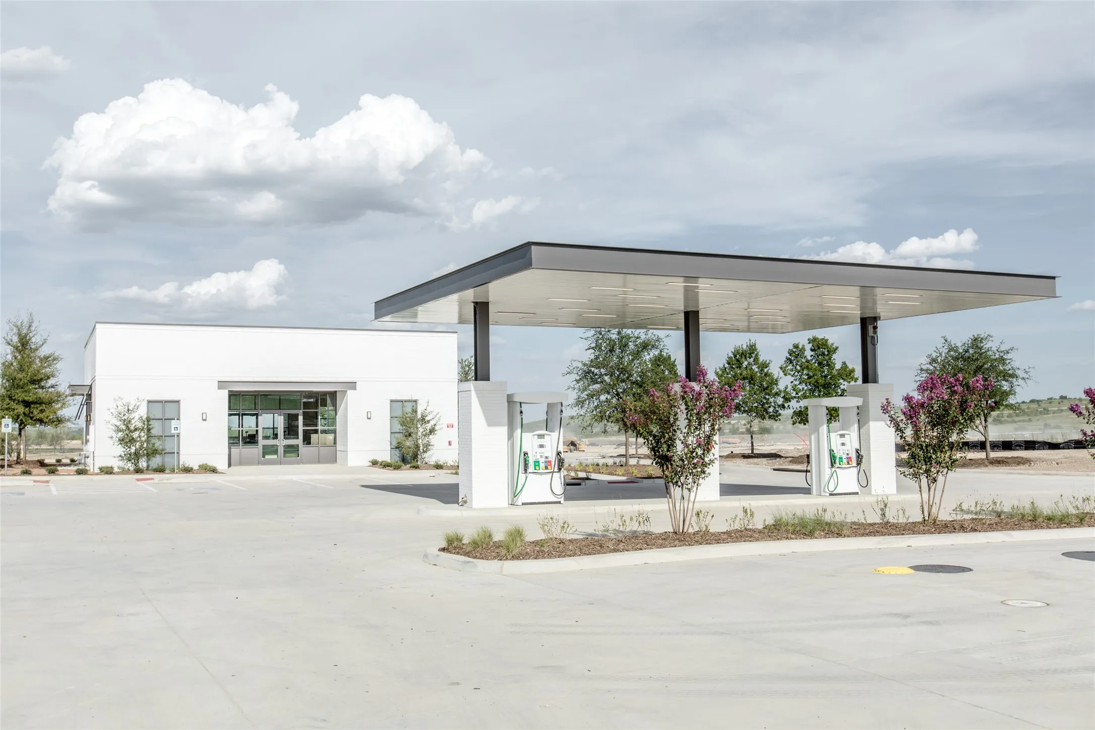 Village market with gas pumps, ATM, EV charger and everyday necessities