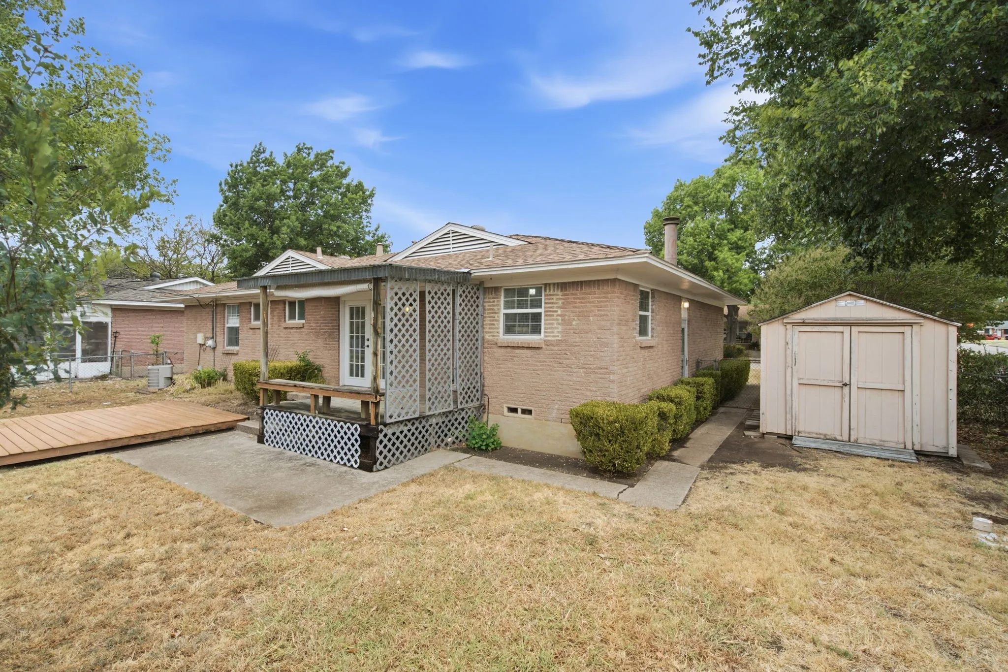 Backyard with storage shed of 300 Parkwood Place, Lewisville, TX in Lakeland Terrace